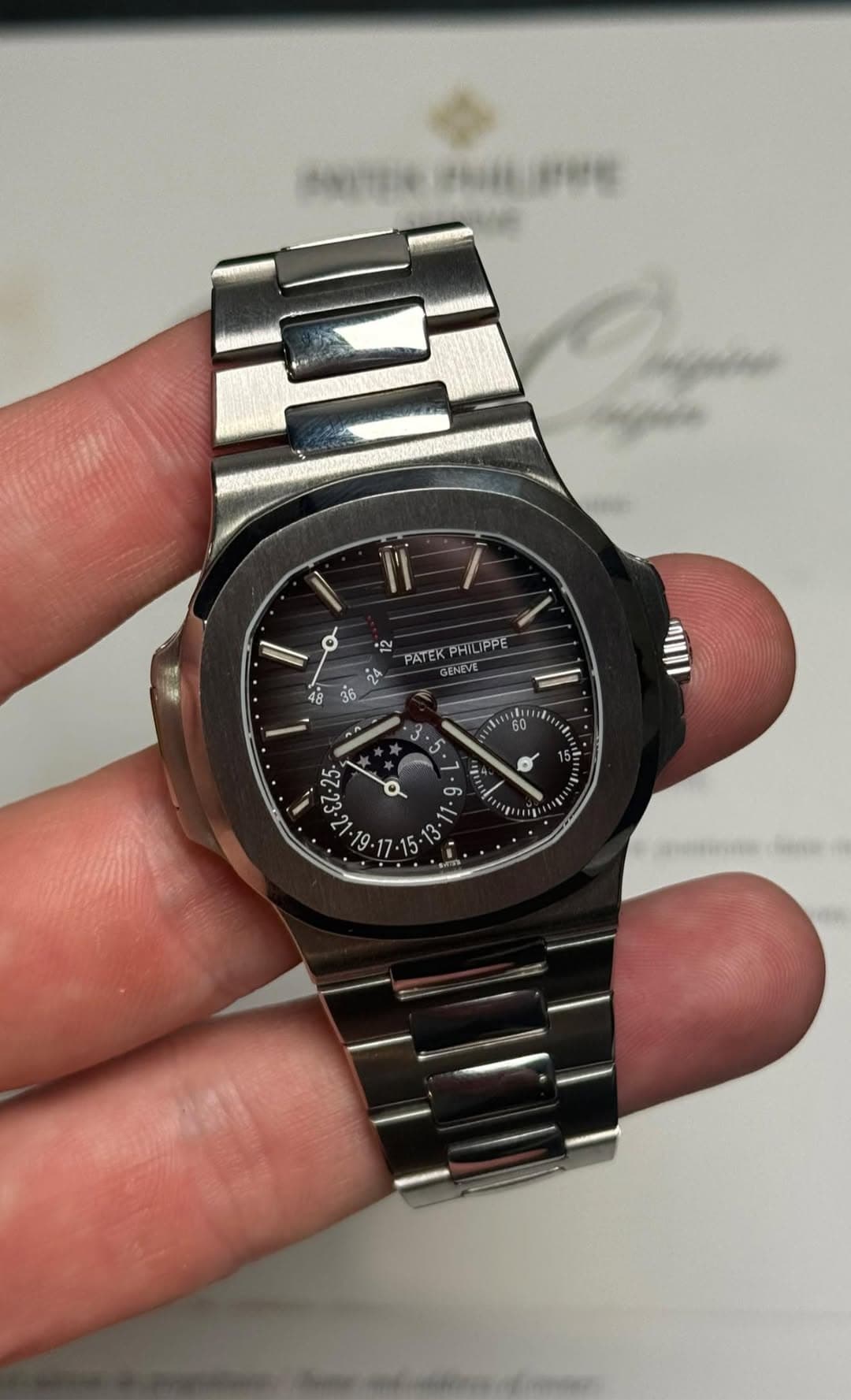 May be an image of wrist watch and text