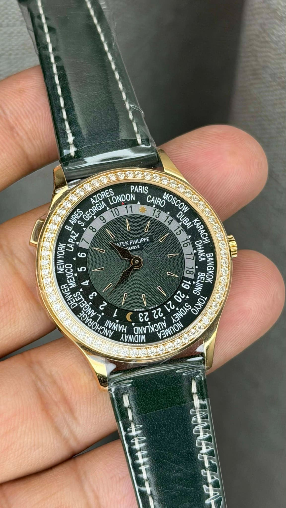 May be an image of wrist watch and text that says 'ATEK EE ENEVE PHILIPPE AZORES LONDON PARIS CAIRO MOSCOW AIRES GEORGIA DUBAI KARACHI APAZ B. 8 ΧΘΟΛΜ3Ν 6 DHAKA UNM MMICOE AIC س…