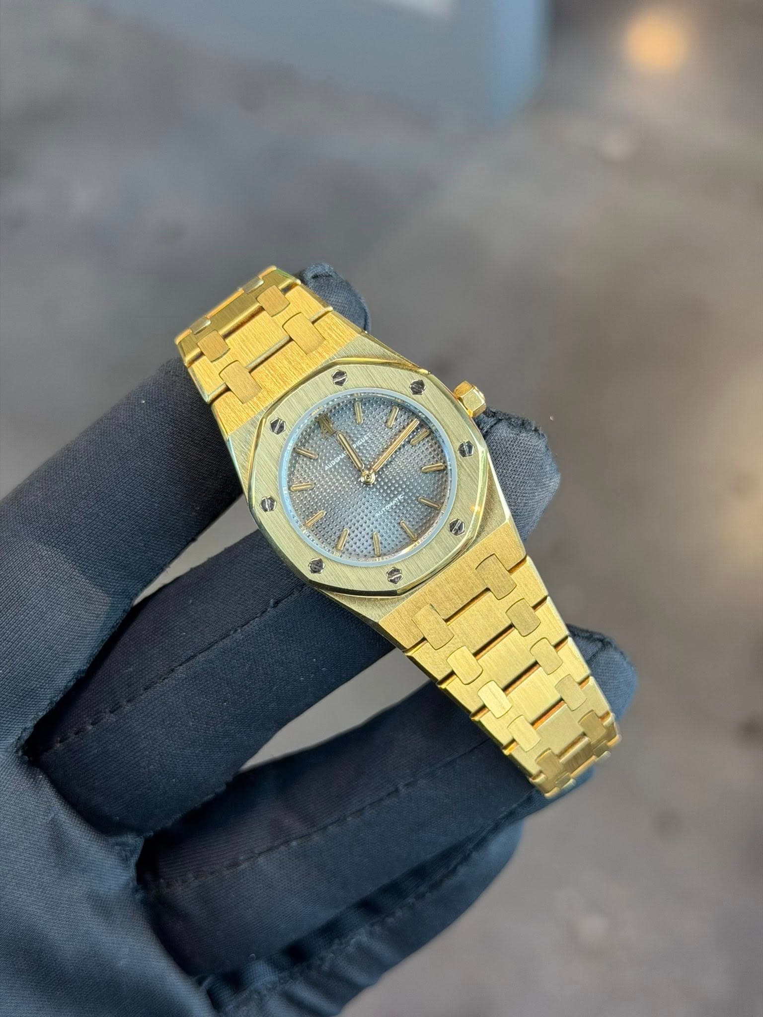 May be an image of wrist watch and text