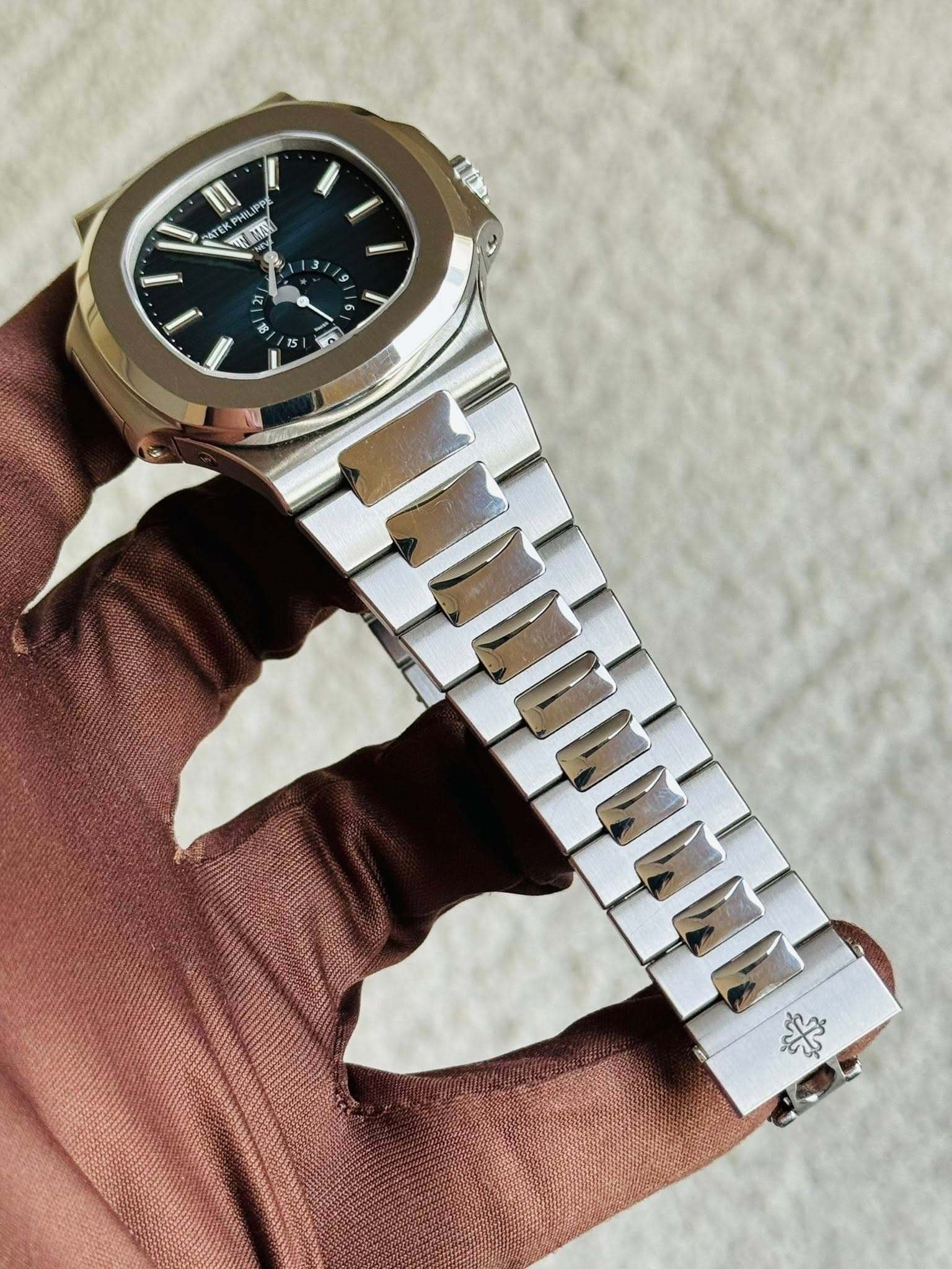 May be an image of wrist watch and text
