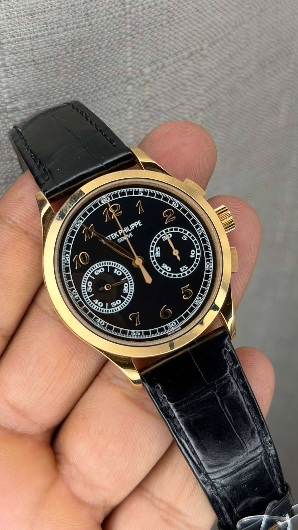 May be an image of wrist watch and text