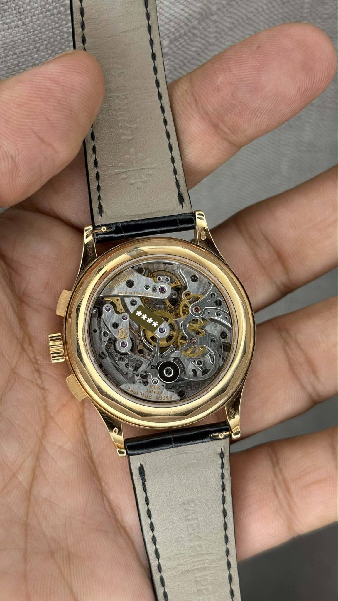 May be an image of wrist watch and text