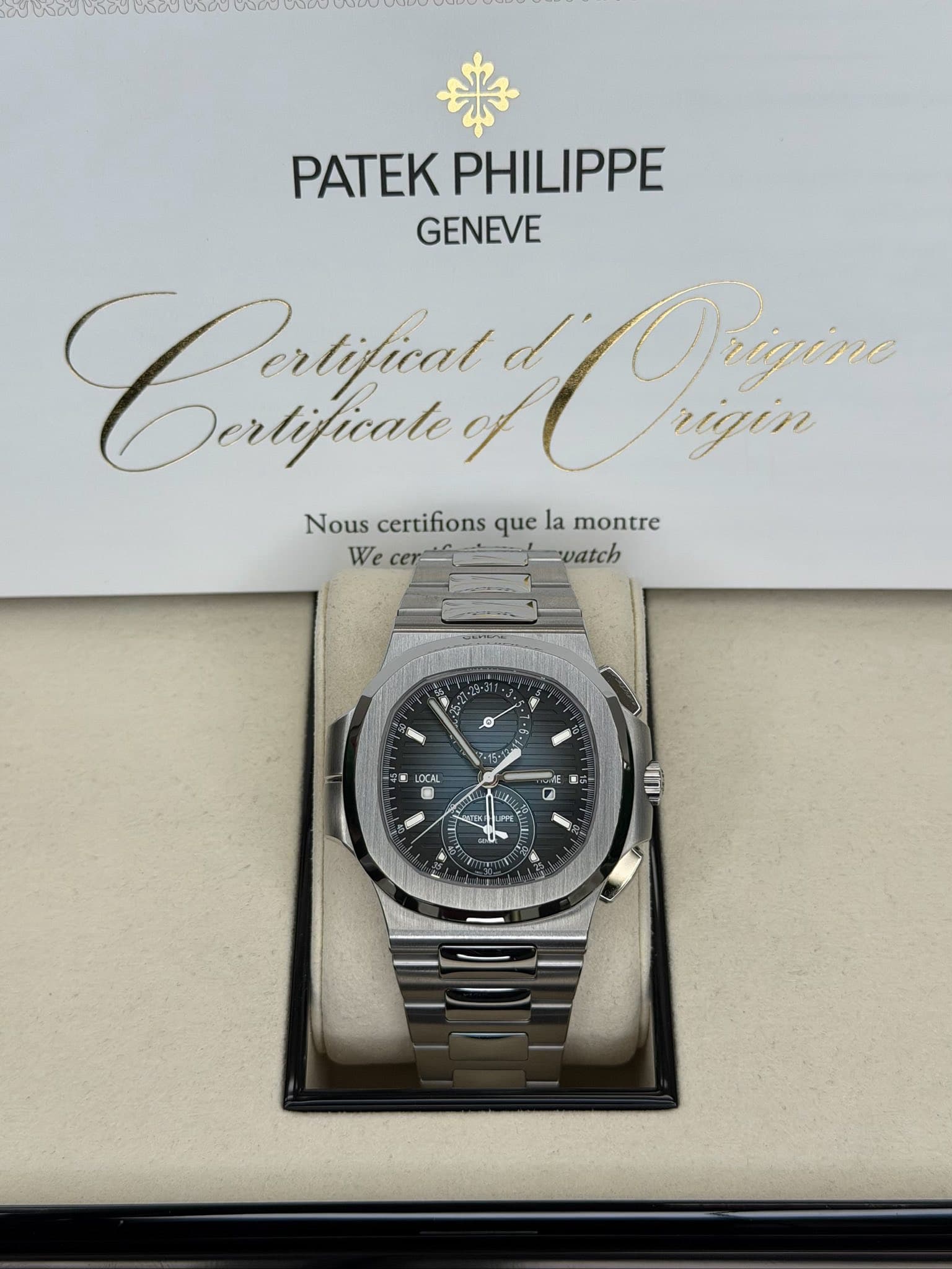 May be an image of wrist watch and text that says 'W0Y PATEKPHILIPPE PATEK PHILIPPE GENEVE Cruyu Dertifical Derlificale of Dram rigin Nous certifions que la montre We cer vatch…
