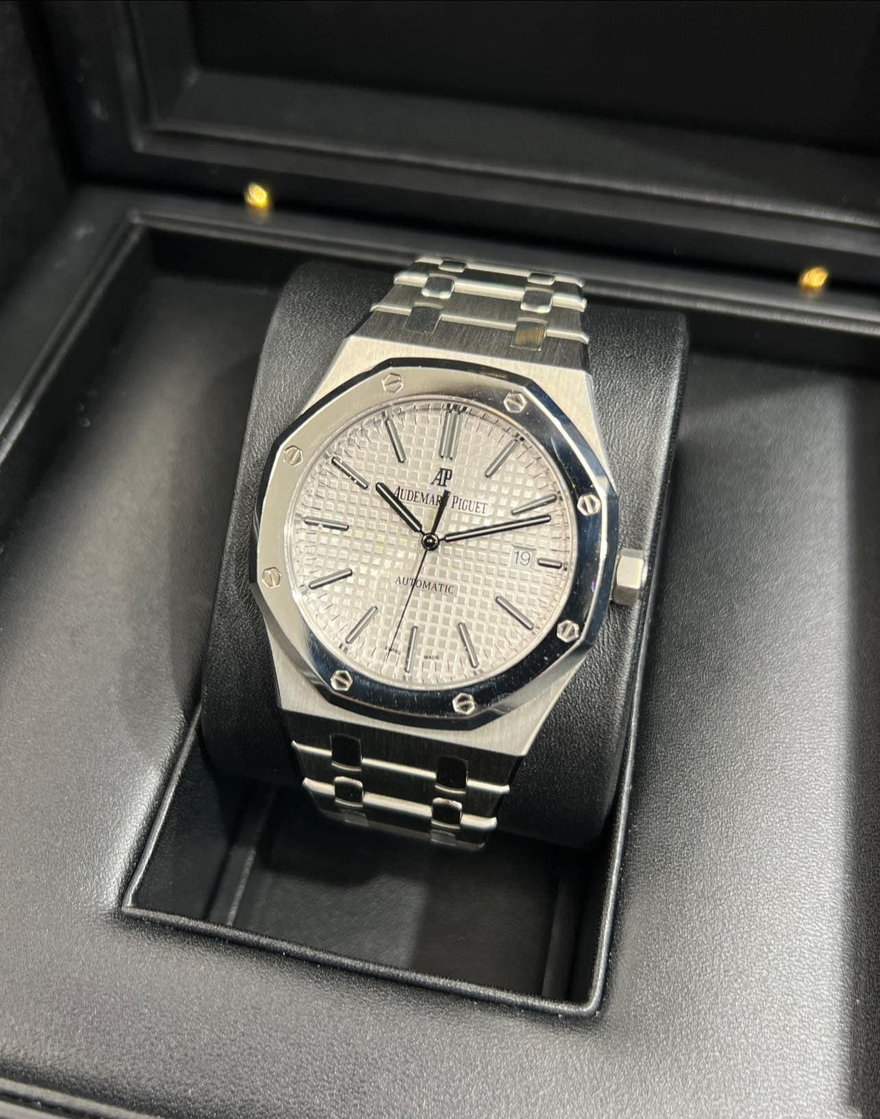 May be an image of wrist watch and text