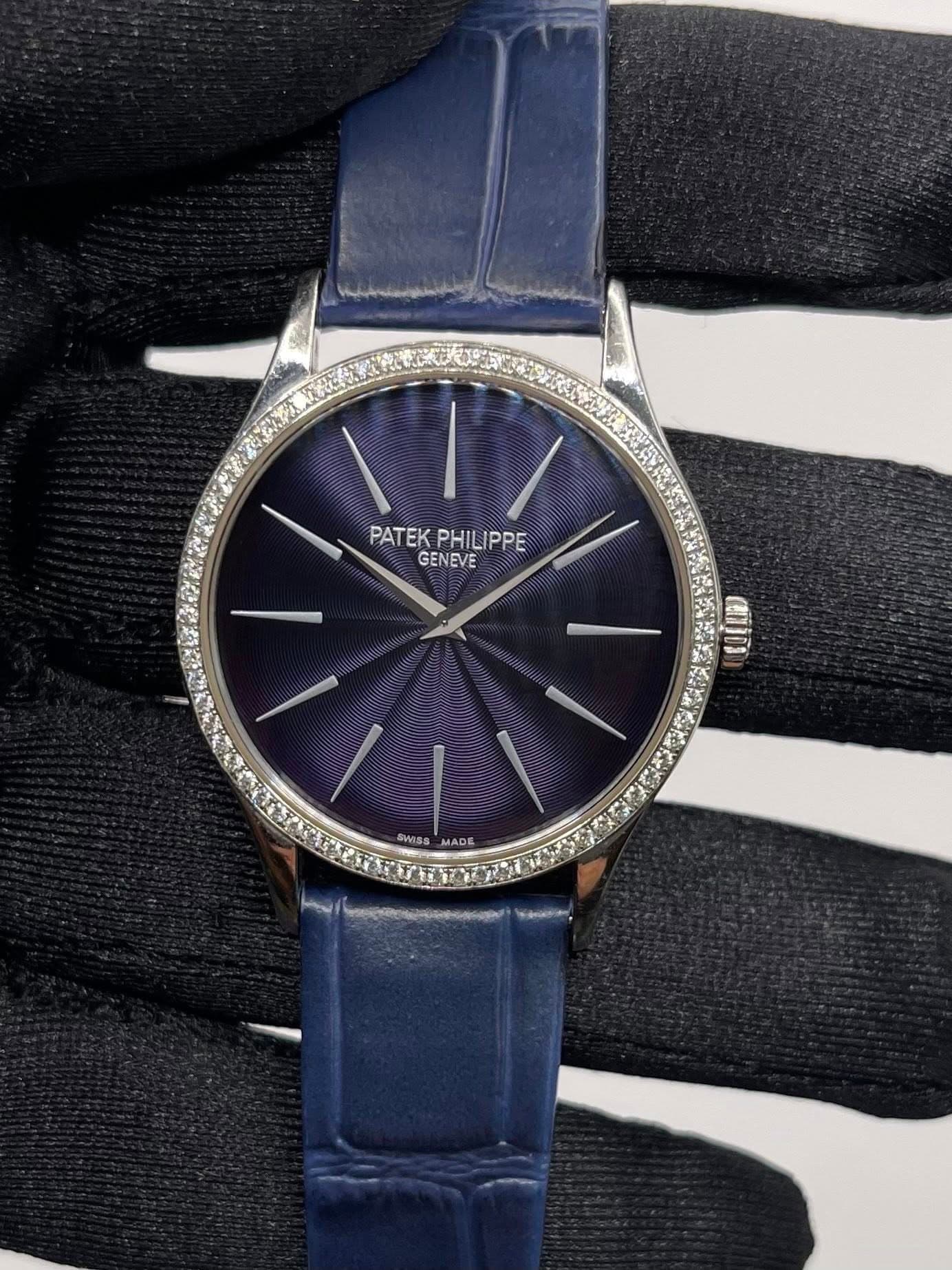 May be an image of wrist watch and text that says 'PATEK_PHILIPPE PATEK PHILIPPE GENEVE SWISS MADE +'