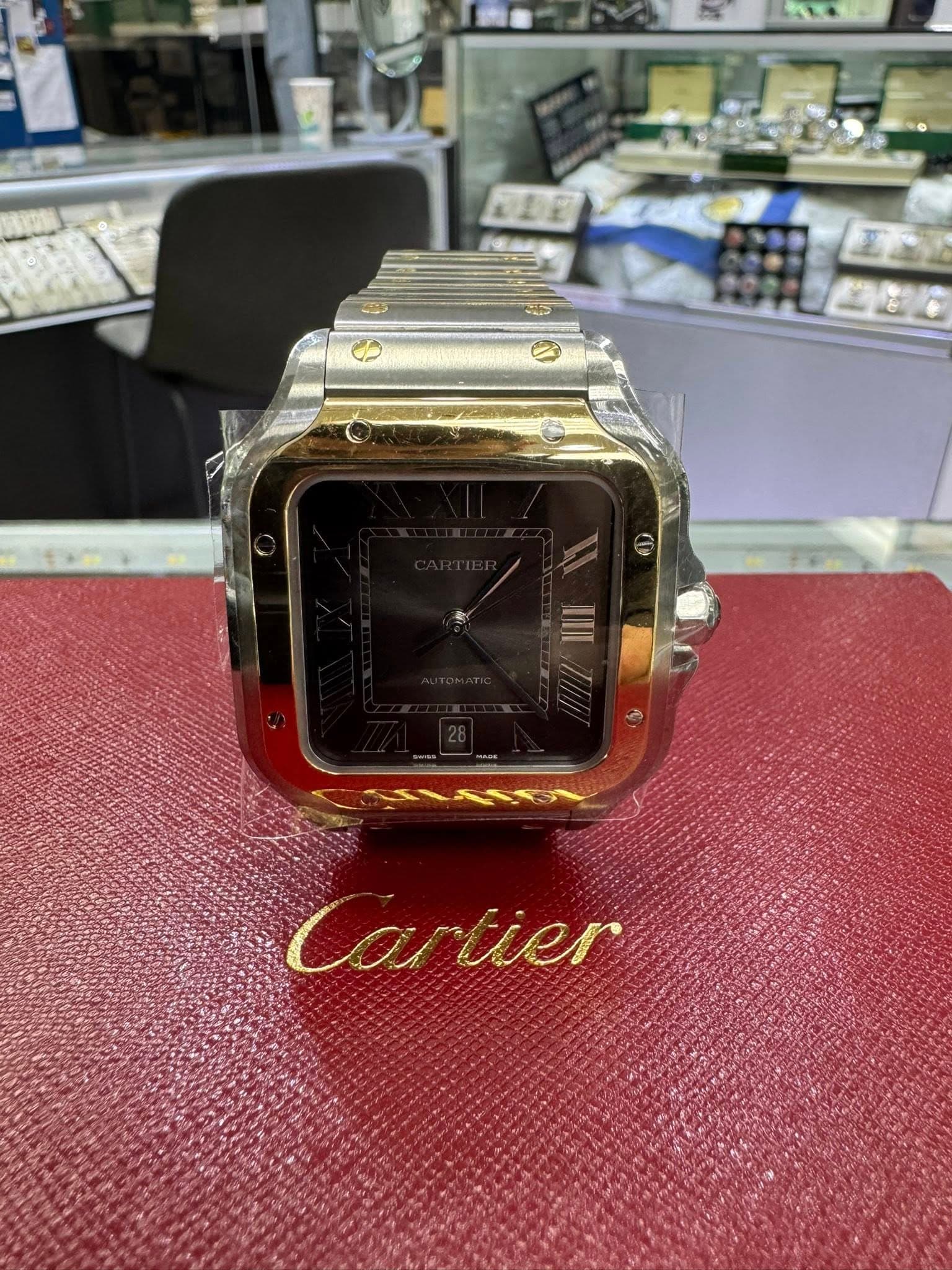 May be an image of digital watch and text that says '原控 Cartier Ca tier'