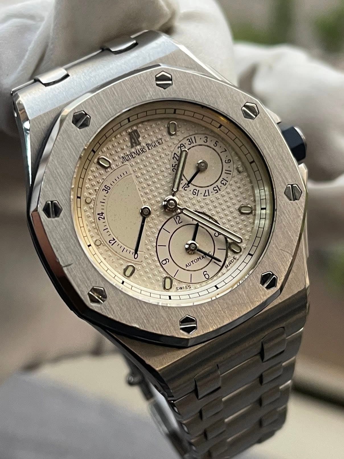 May be an image of wrist watch and text