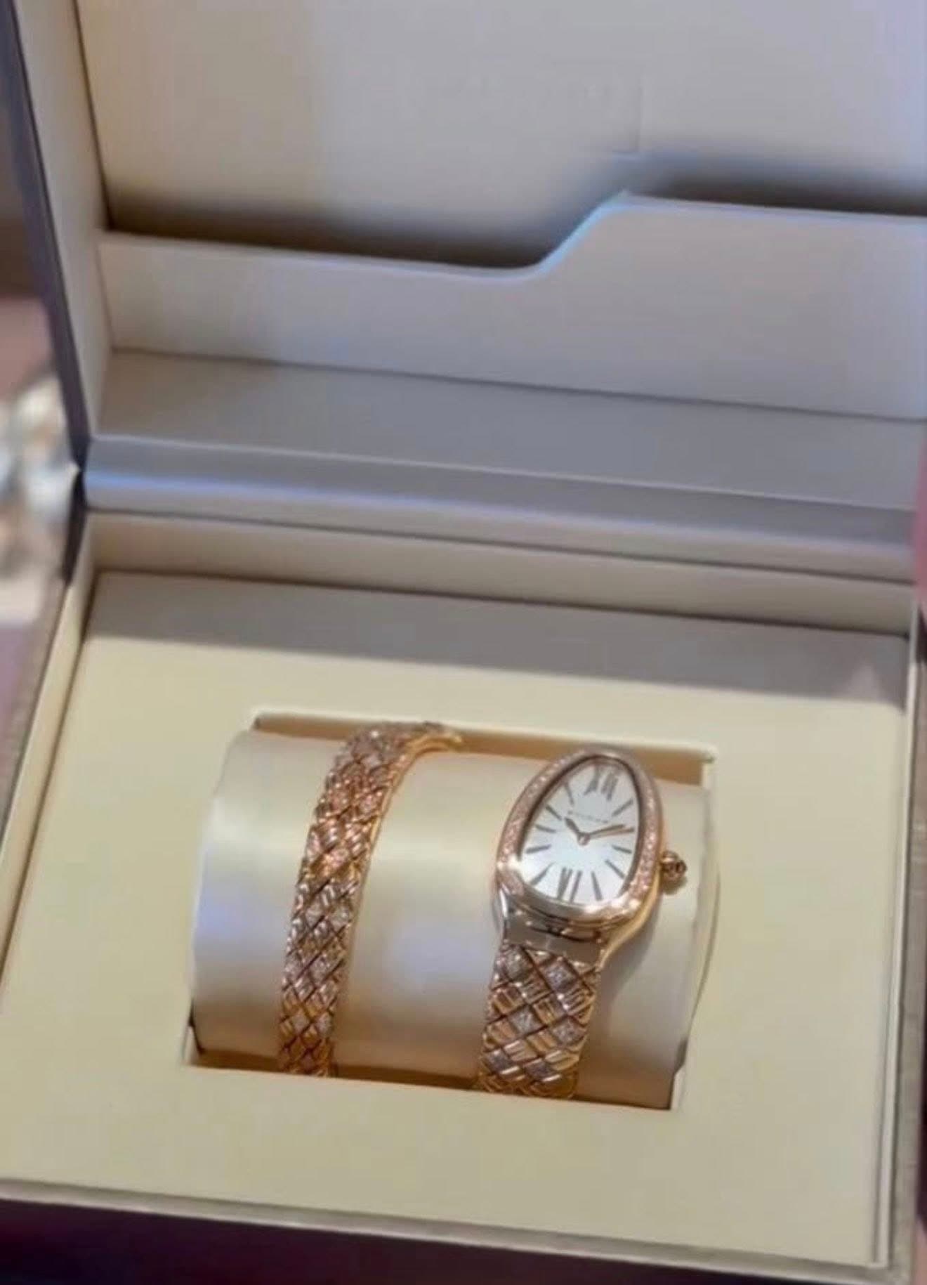 May be an image of wrist watch and jewelry