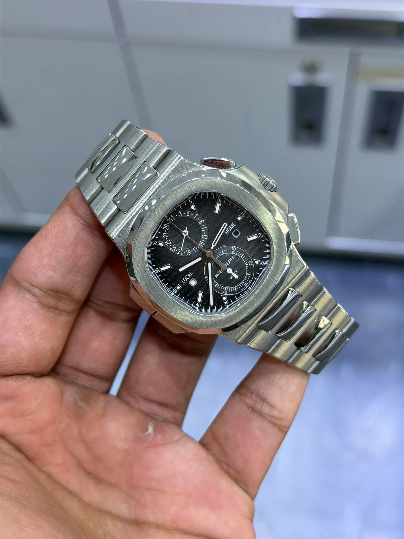 May be an image of wrist watch and text