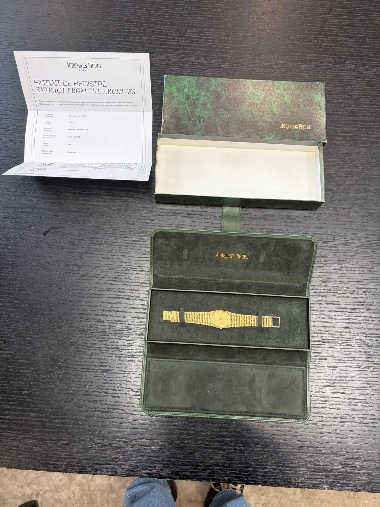 May be an image of saddle-stitched leather, leather wallet and text
