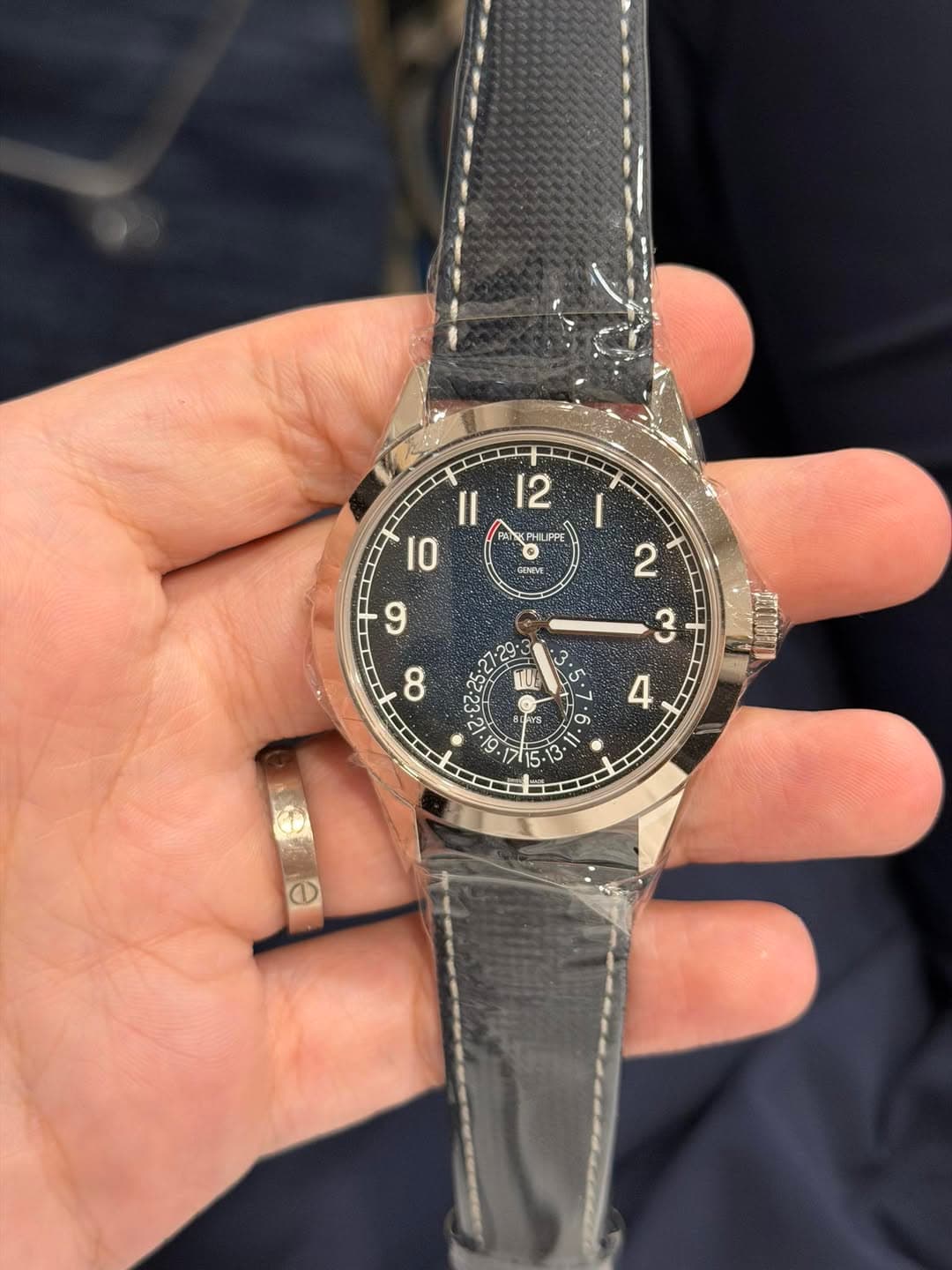 May be an image of wrist watch and text