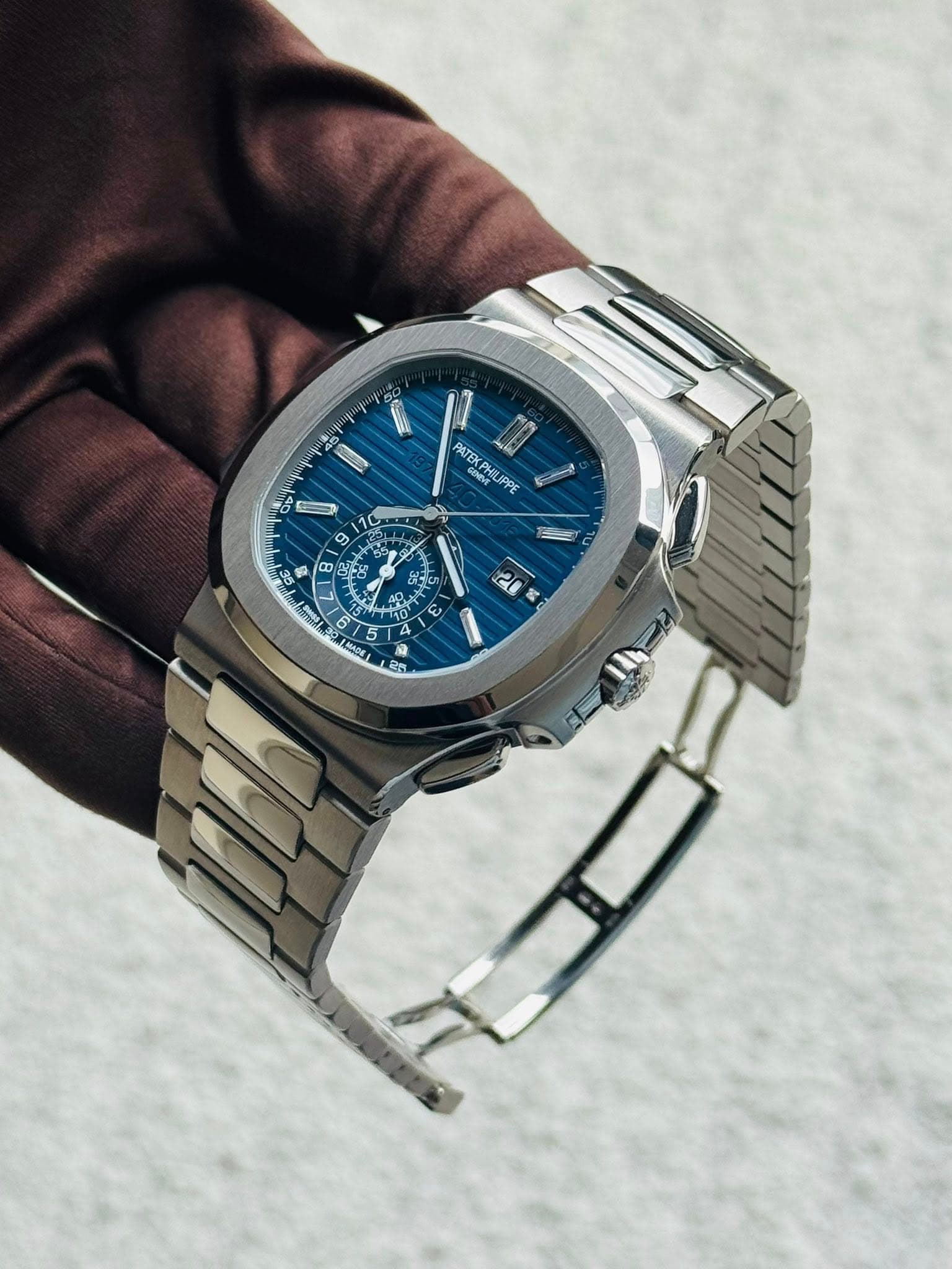 May be an image of wrist watch and text