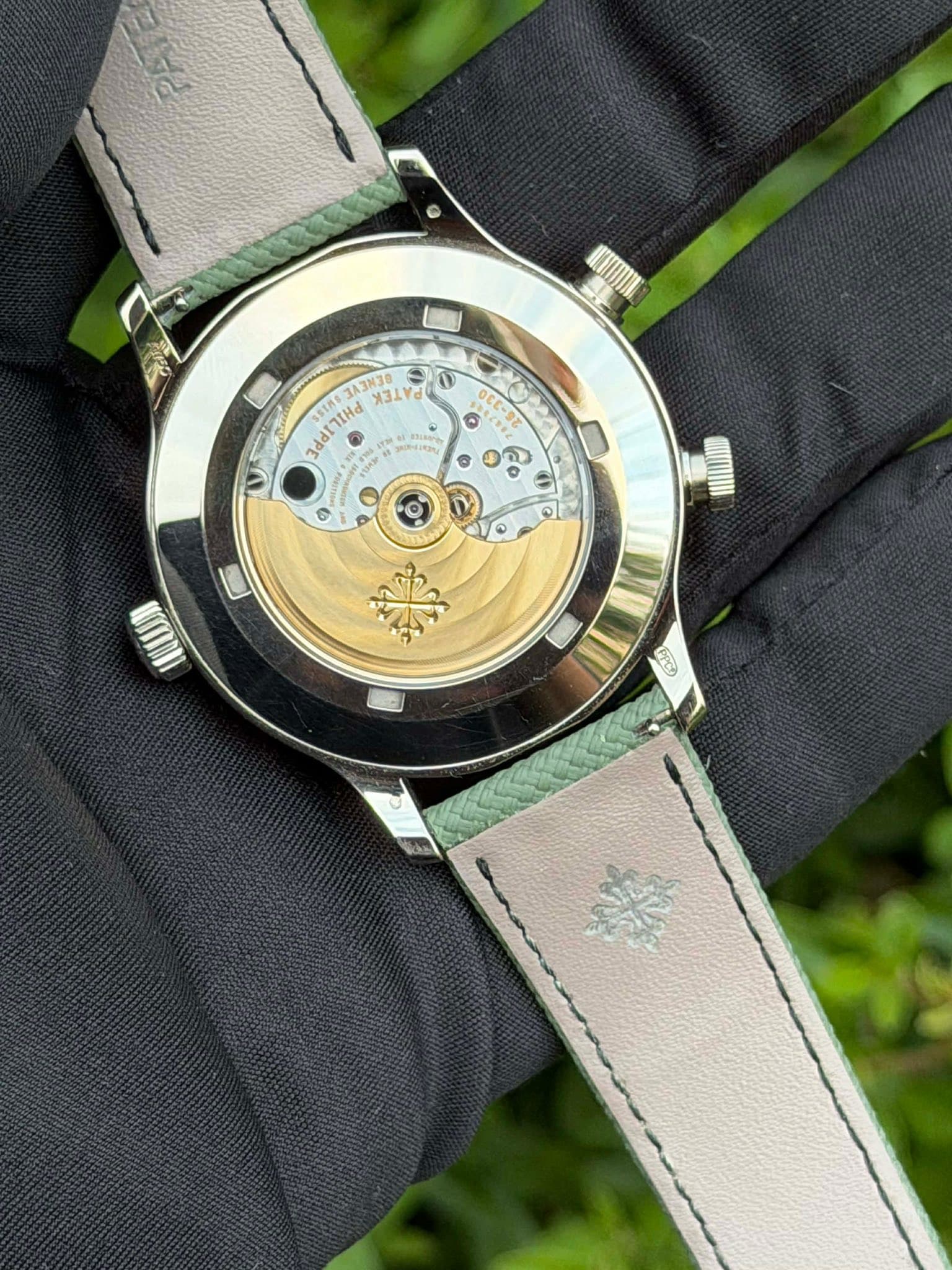 May be an image of wrist watch and text