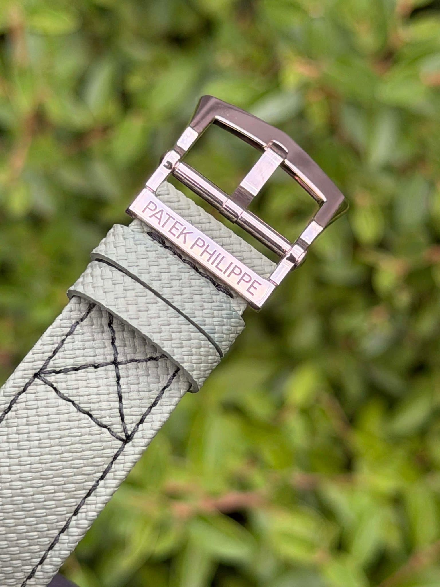 May be an image of wrist watch, saddle-stitched leather and text that says 'PATEKPHILIPPE PATEK PHILIPPE'