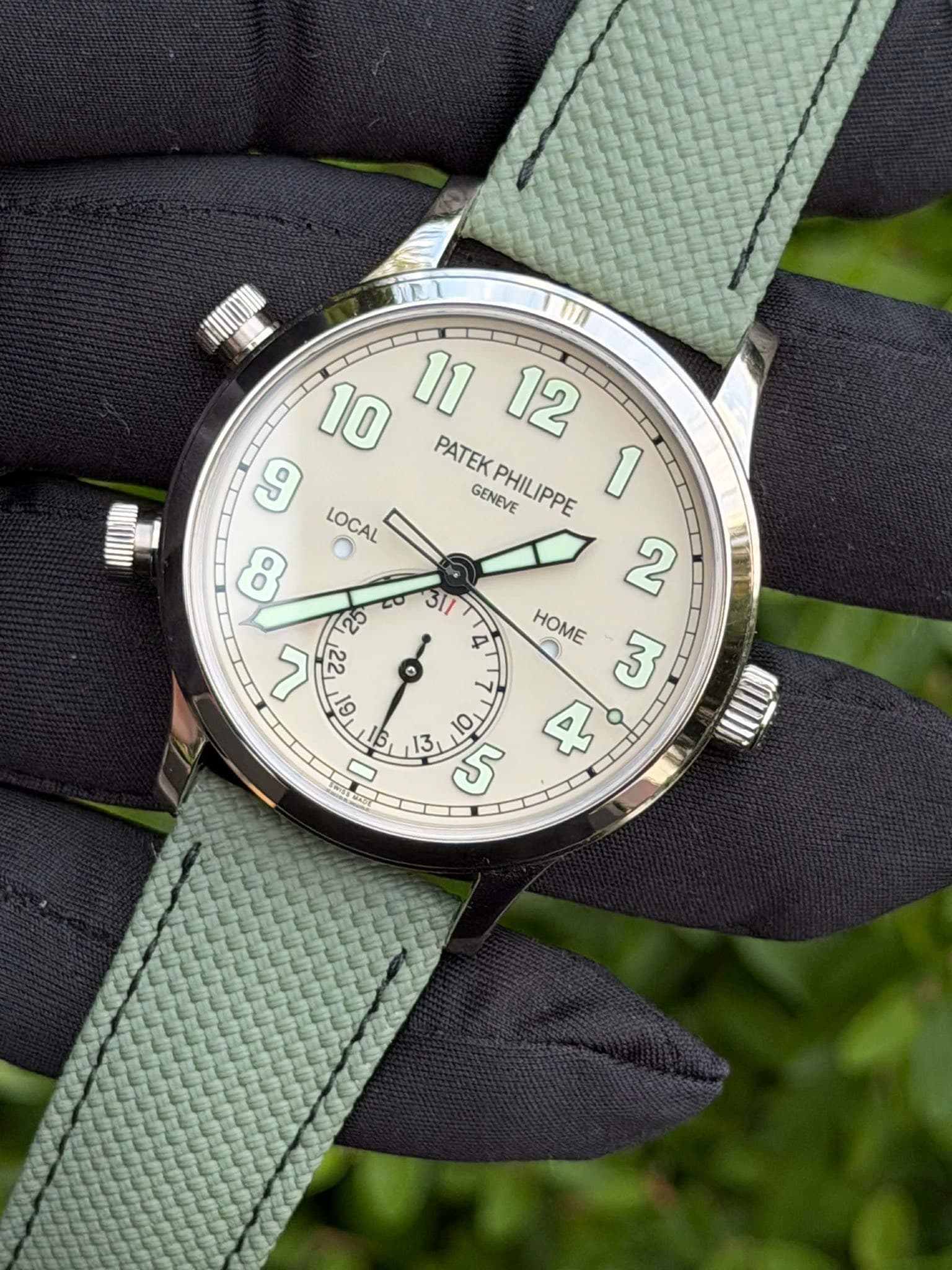 May be an image of wrist watch and text that says 'MI PATEK LOCAL GENEVE PHILIPPE 1 ထ 2 τ6 311 20 ک 2ટ 22 4 ਲ HOME 0 o 13 5 4 0 MOTIII'