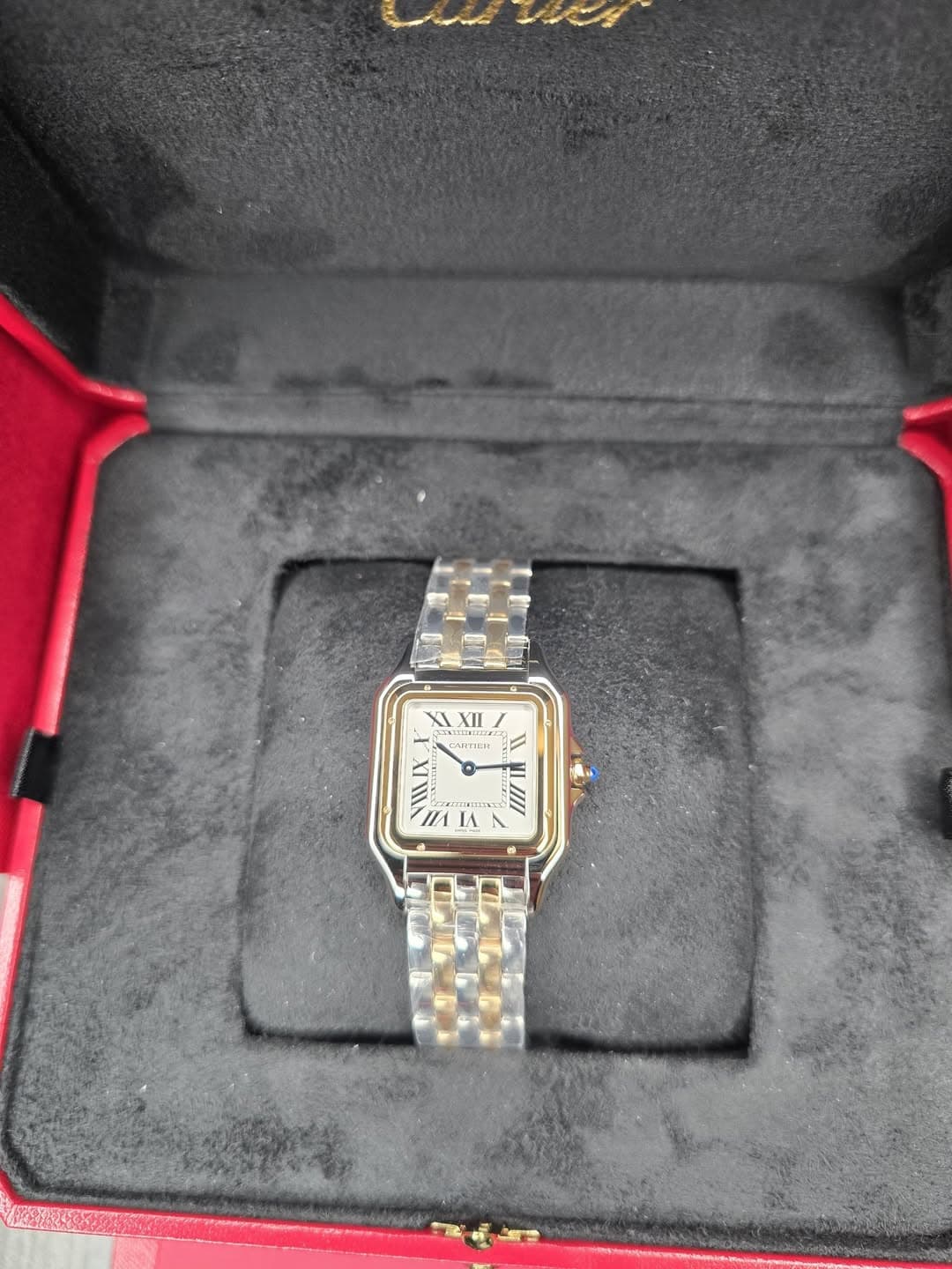 May be an image of wrist watch and text