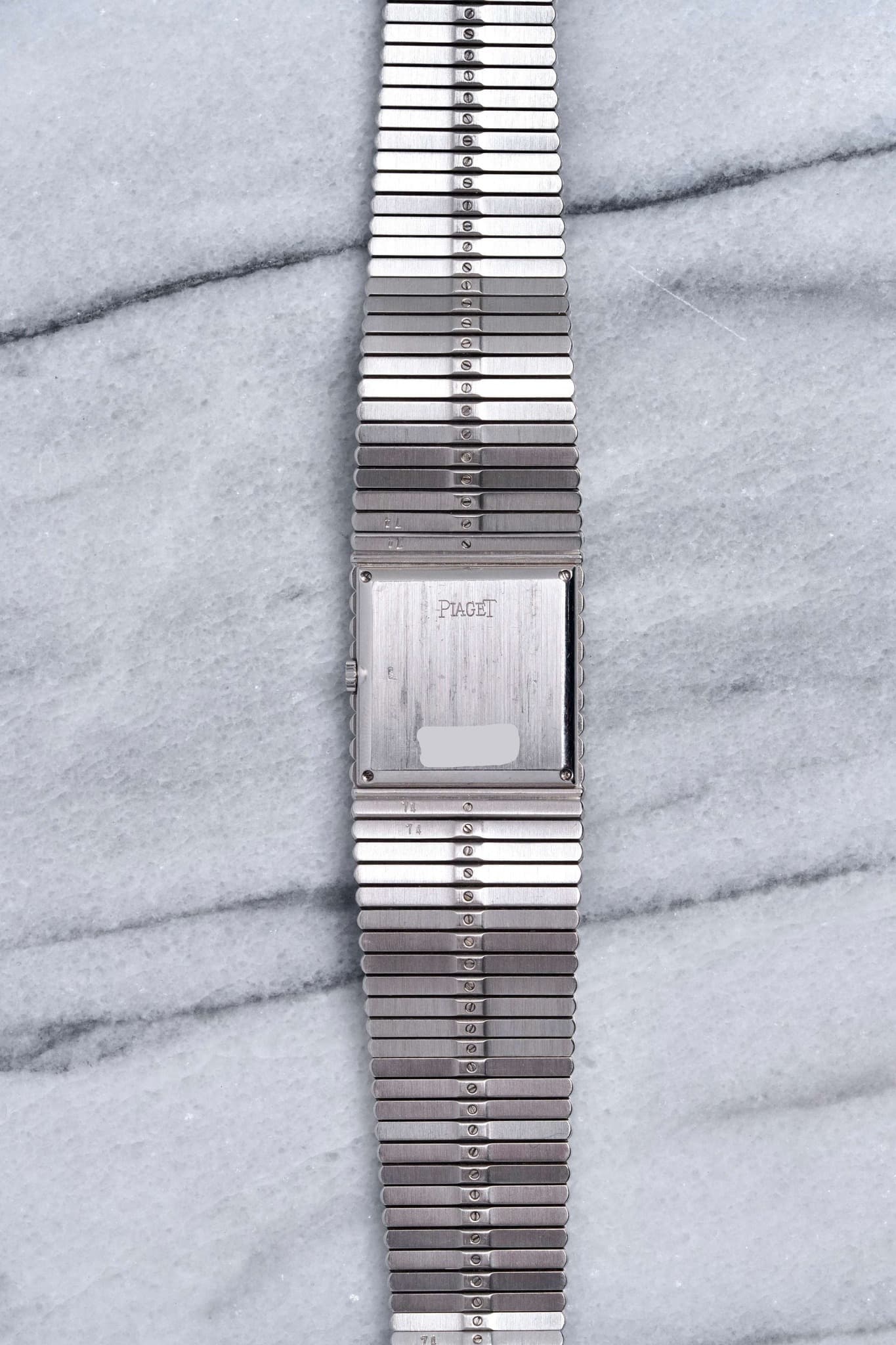 May be an image of wrist watch and text that says '0 3 Q እወ 2 S 4D e ॐ 8 E e @ PIAGET 1$ S S 0 G ® Ф Ф O C A L 20 e 8 9 ه O'