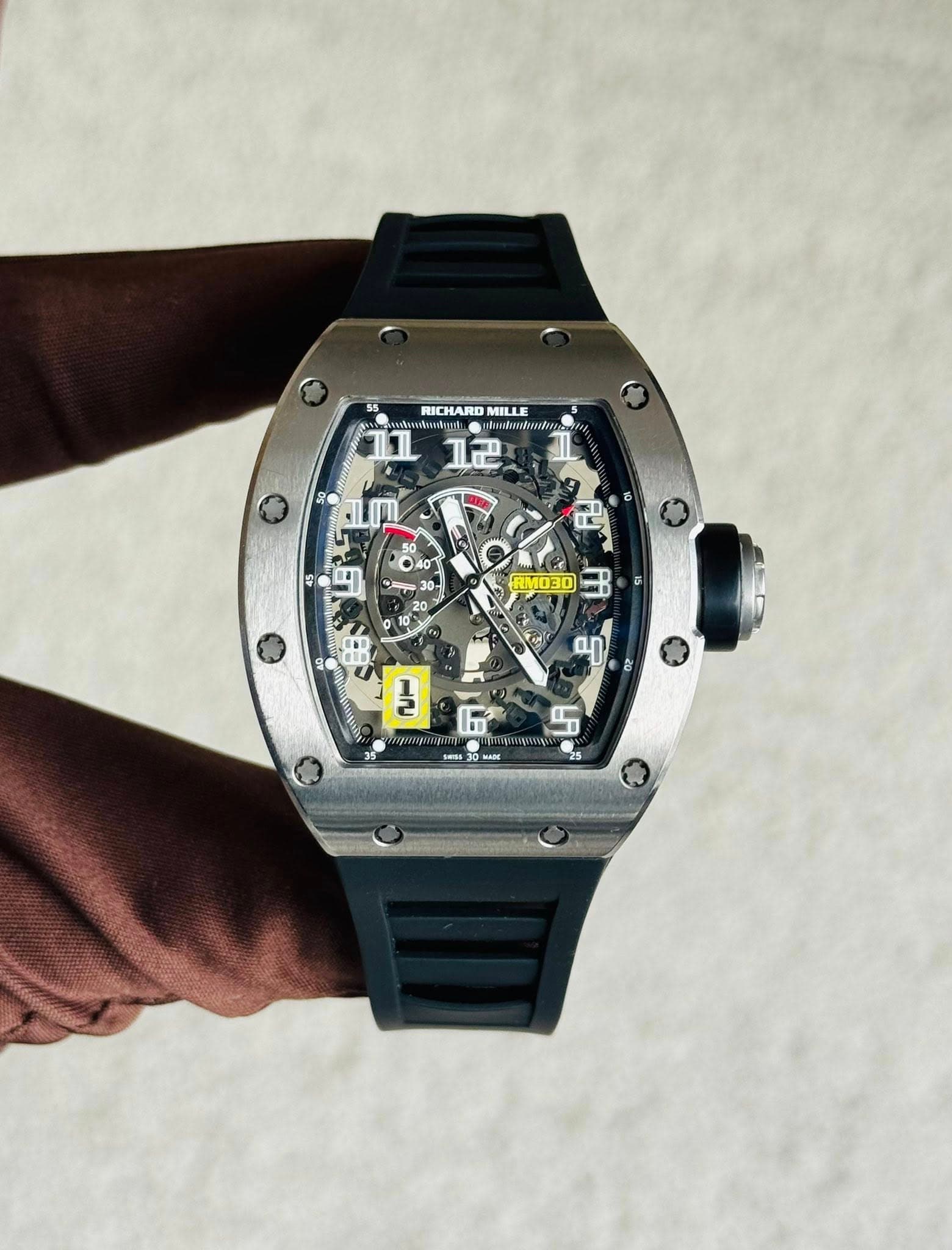 May be an image of wrist watch and text