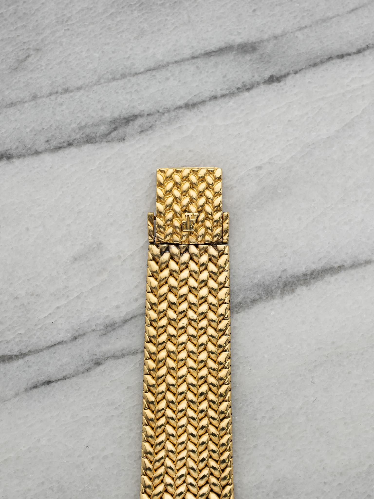 May be an image of wrist watch and jewelry