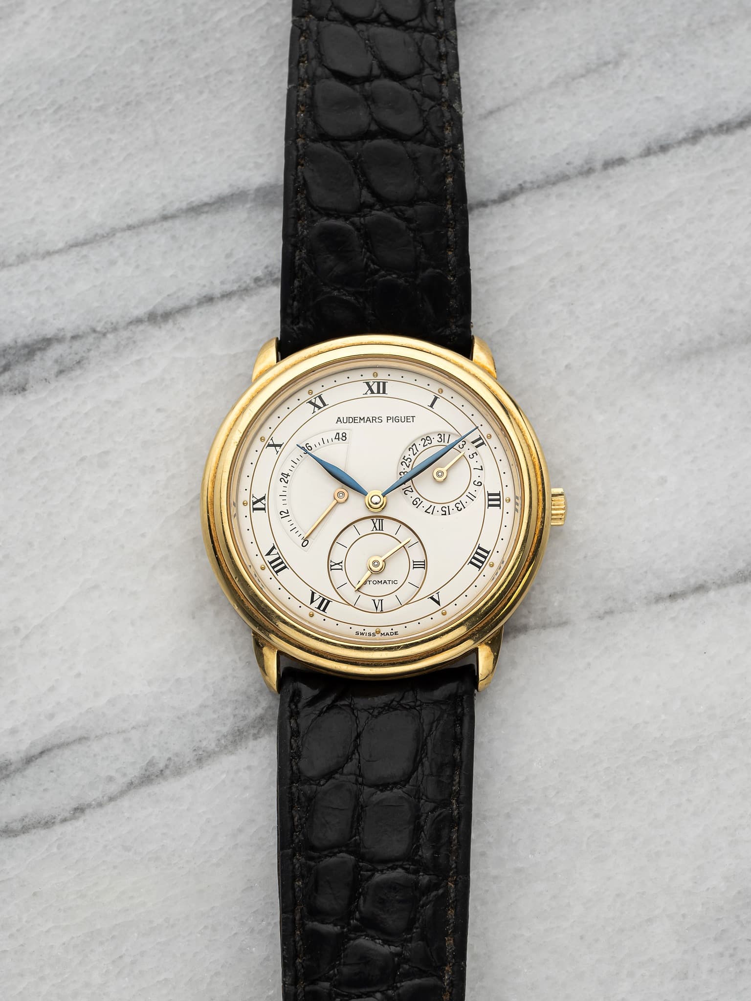 May be an image of leather, wrist watch and text