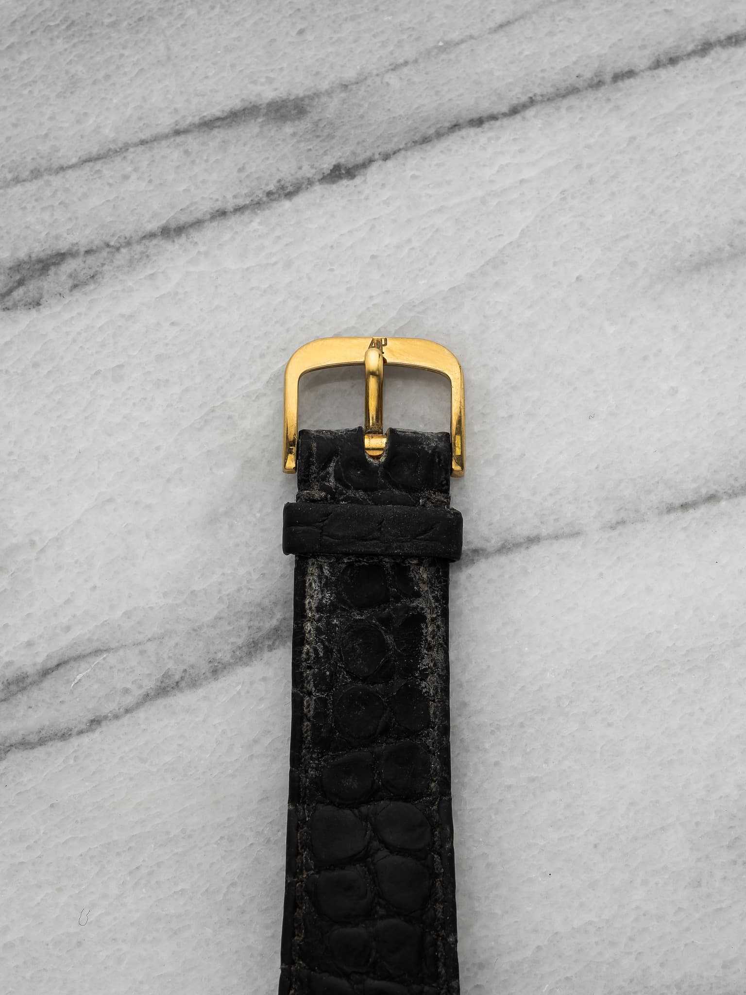 May be an image of leather, wrist watch and saddle-stitched leather