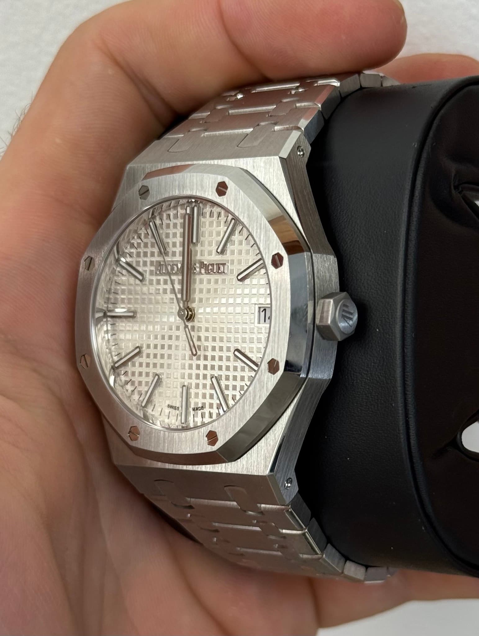 May be an image of wrist watch and text