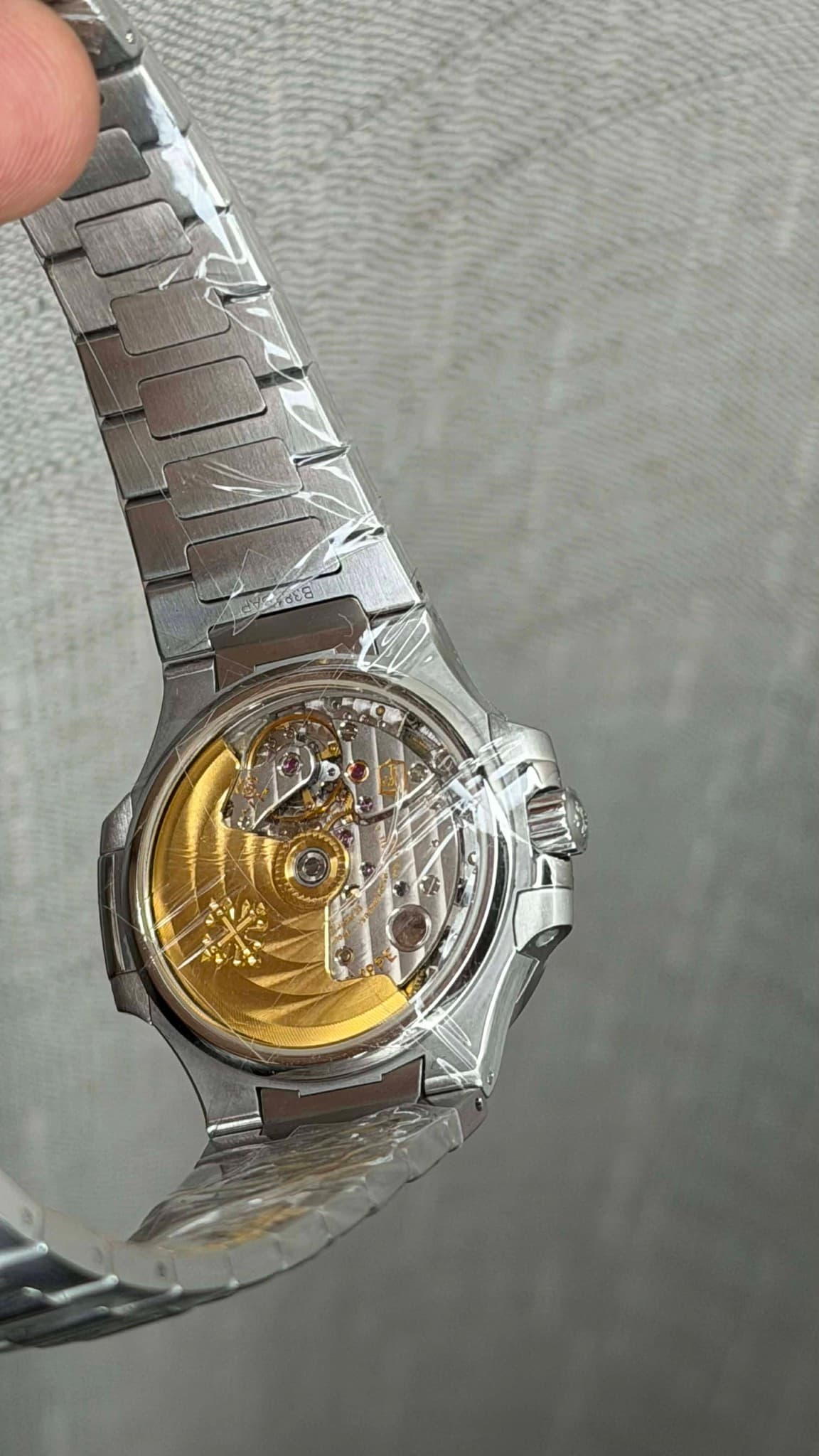 May be an image of wrist watch and text