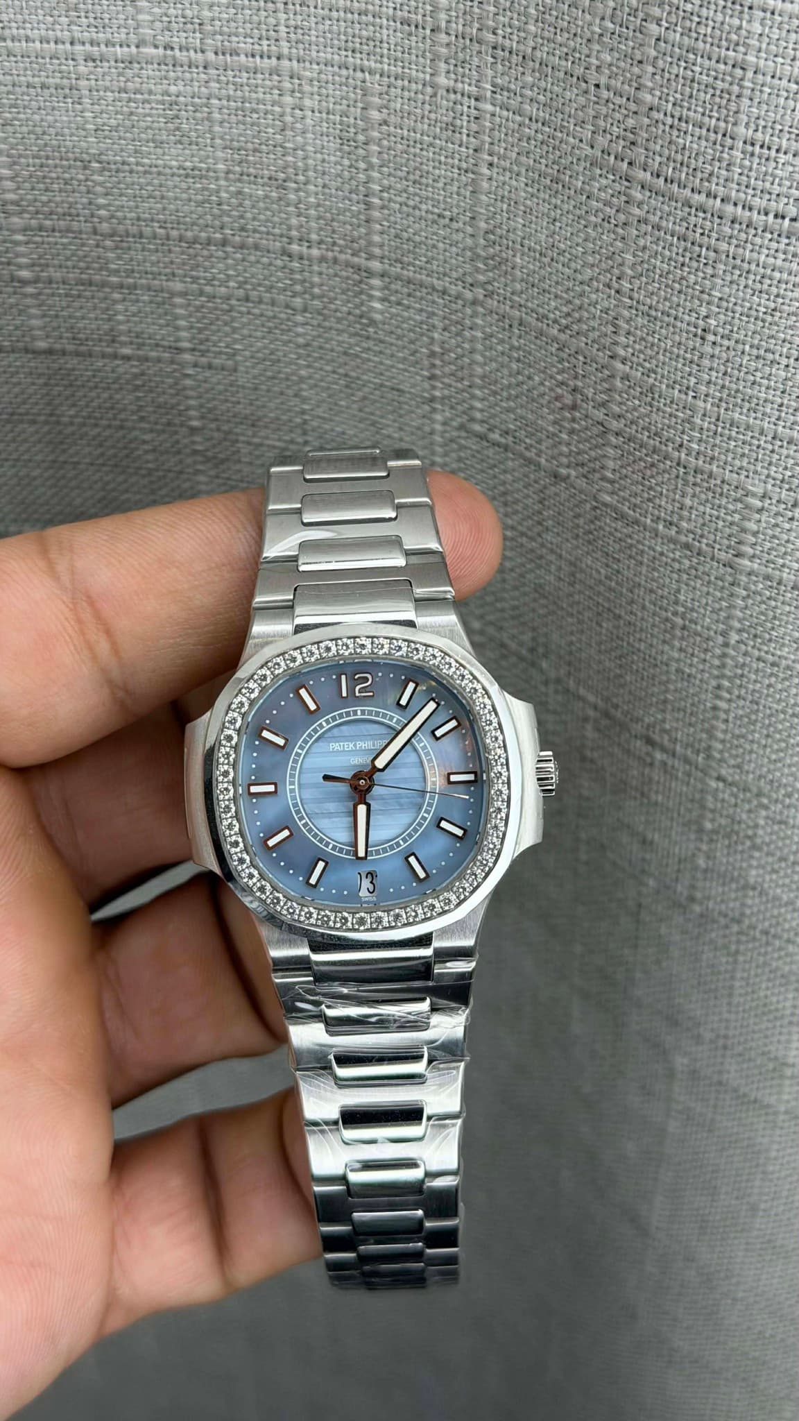 May be an image of wrist watch and text
