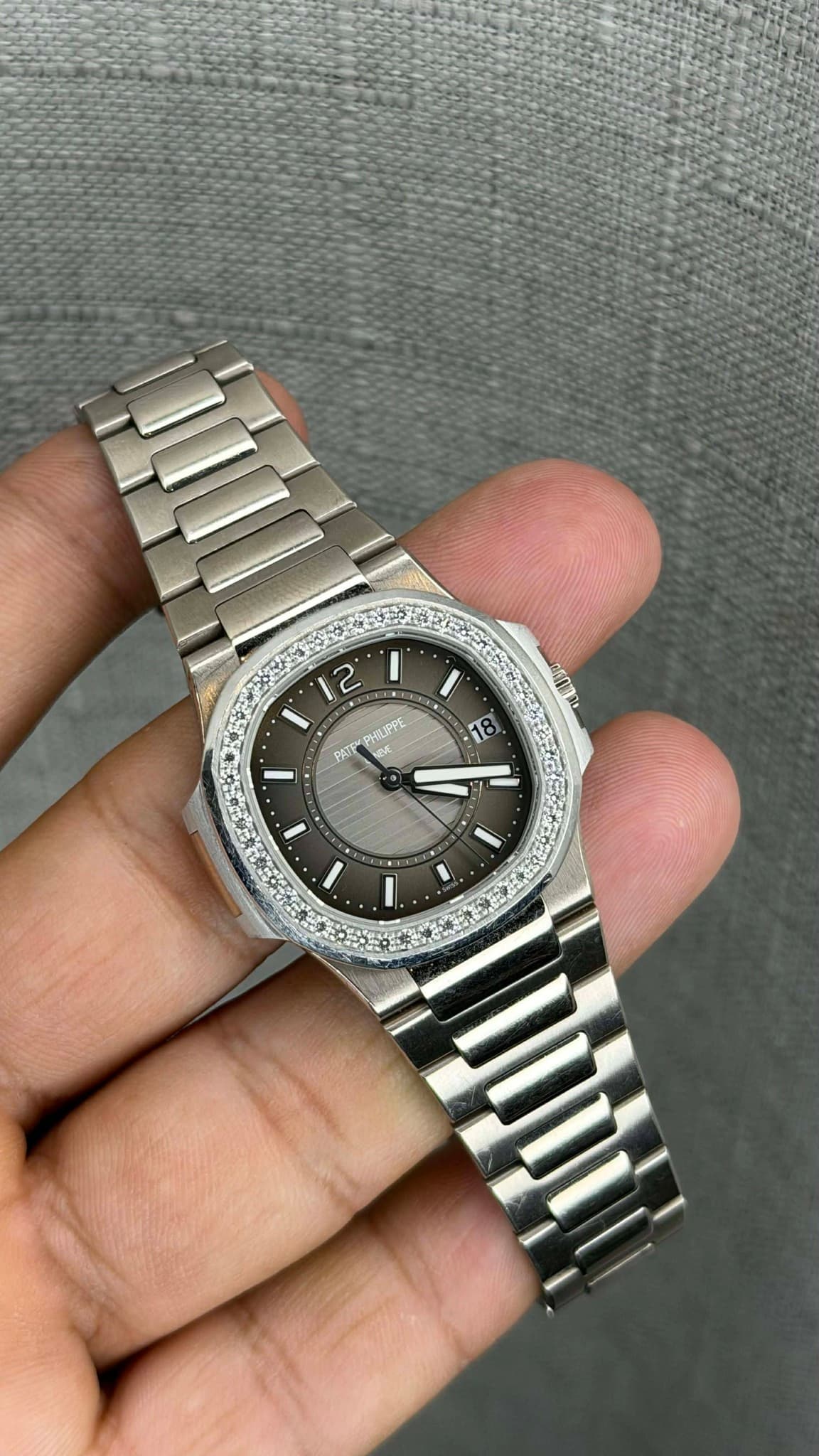 May be an image of wrist watch and text