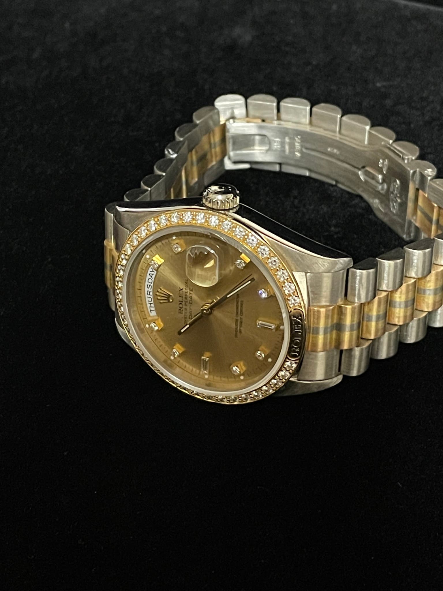 May be an image of wrist watch and text