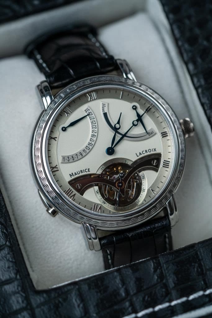 May be an image of wrist watch and text that says '. HeH ㅅ III LACROIX IIII MAURICE יזייייגס' 15 יגס' 100'
