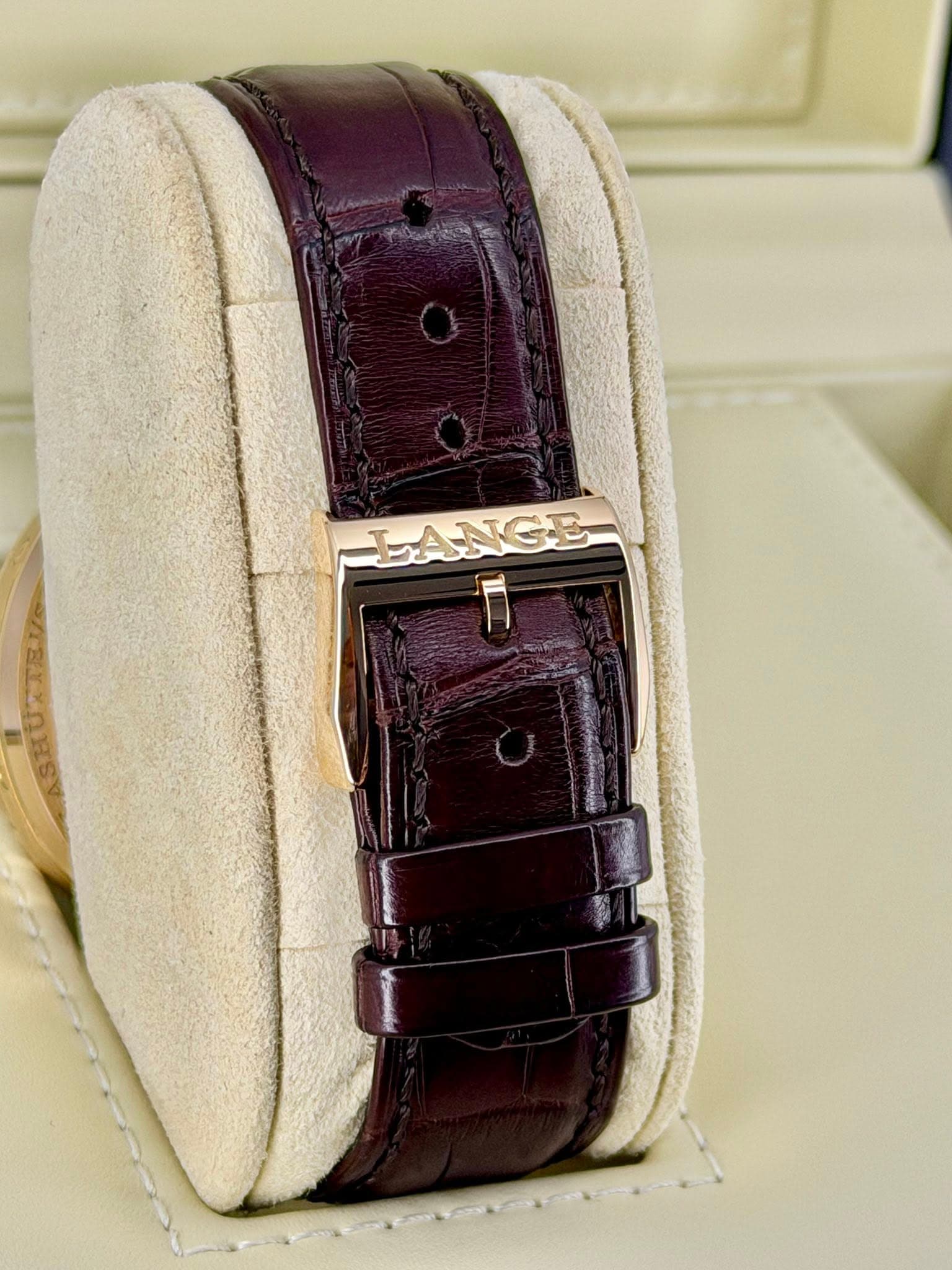 May be an image of leather, wrist watch and text that says 'LANGE F'