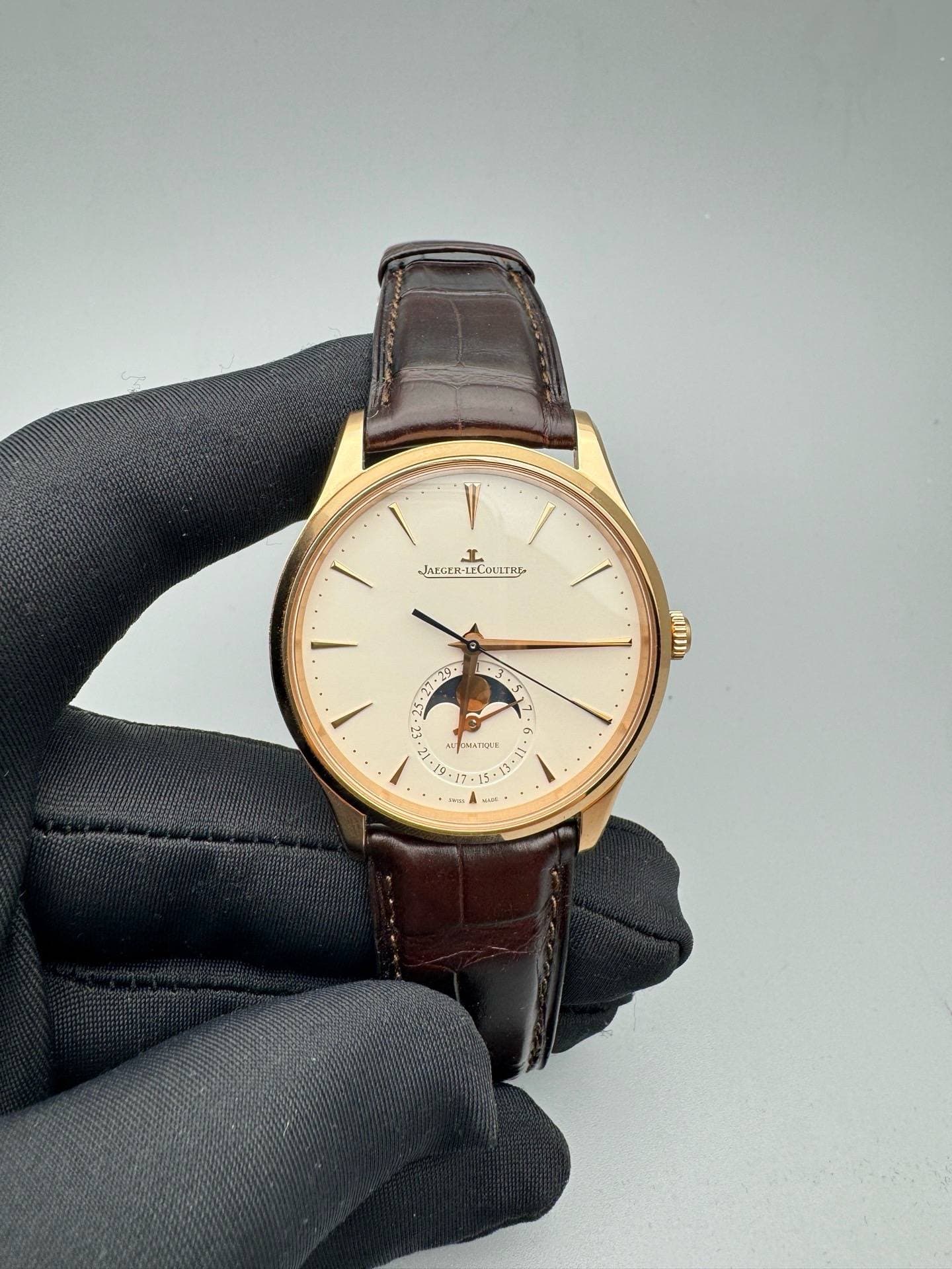 May be an image of wrist watch, leather and text