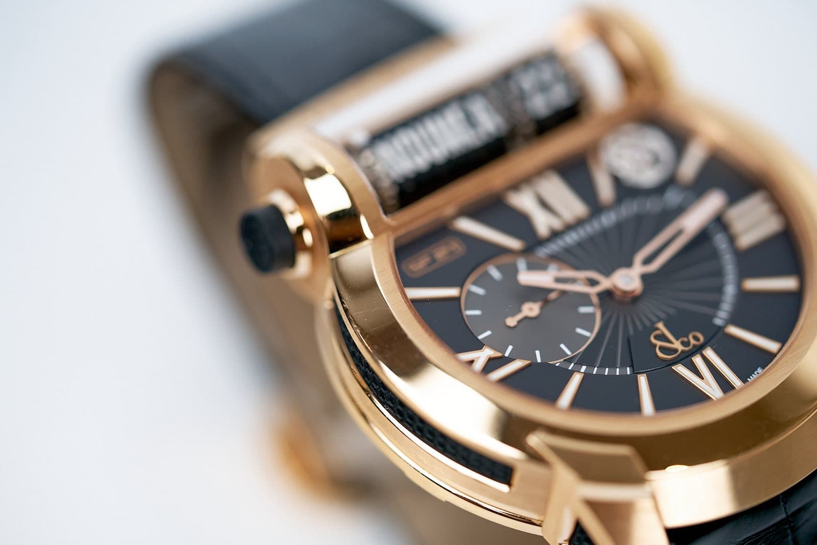 May be an image of wrist watch and text