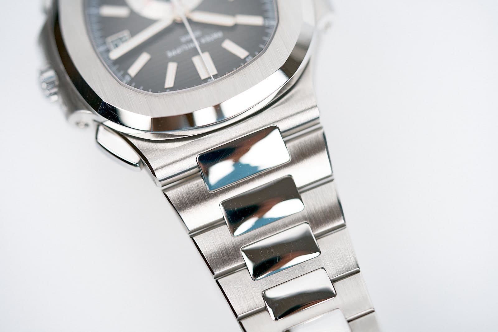 May be an image of wrist watch and text