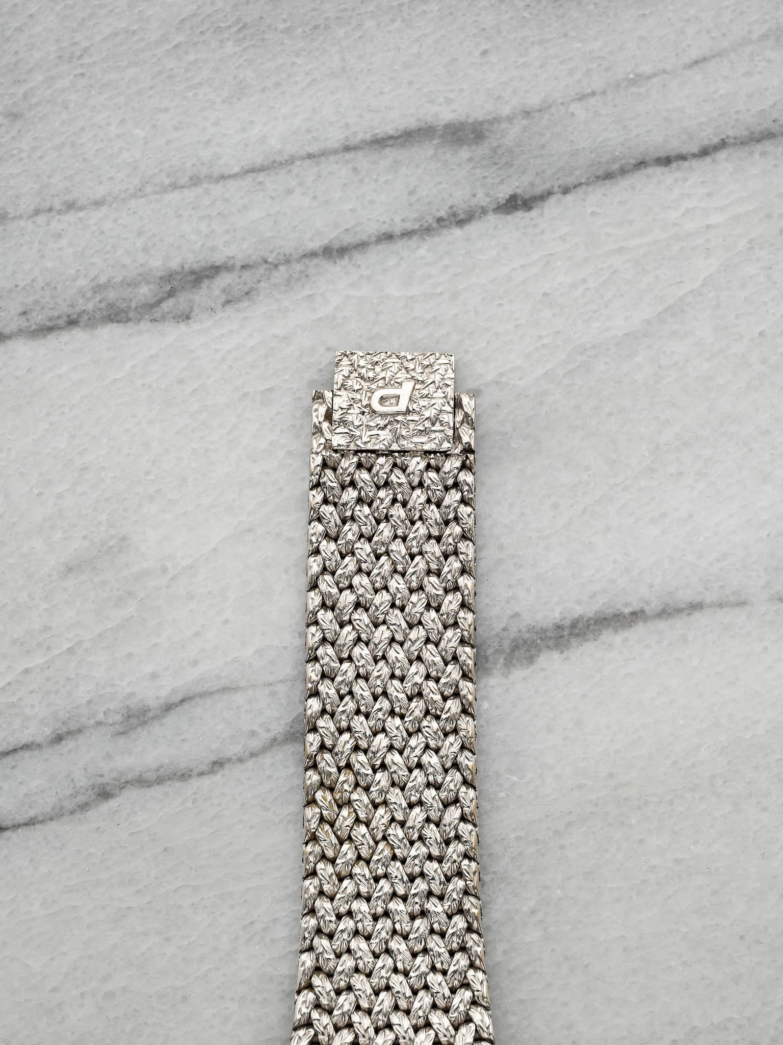 May be an image of jewelry and wrist watch