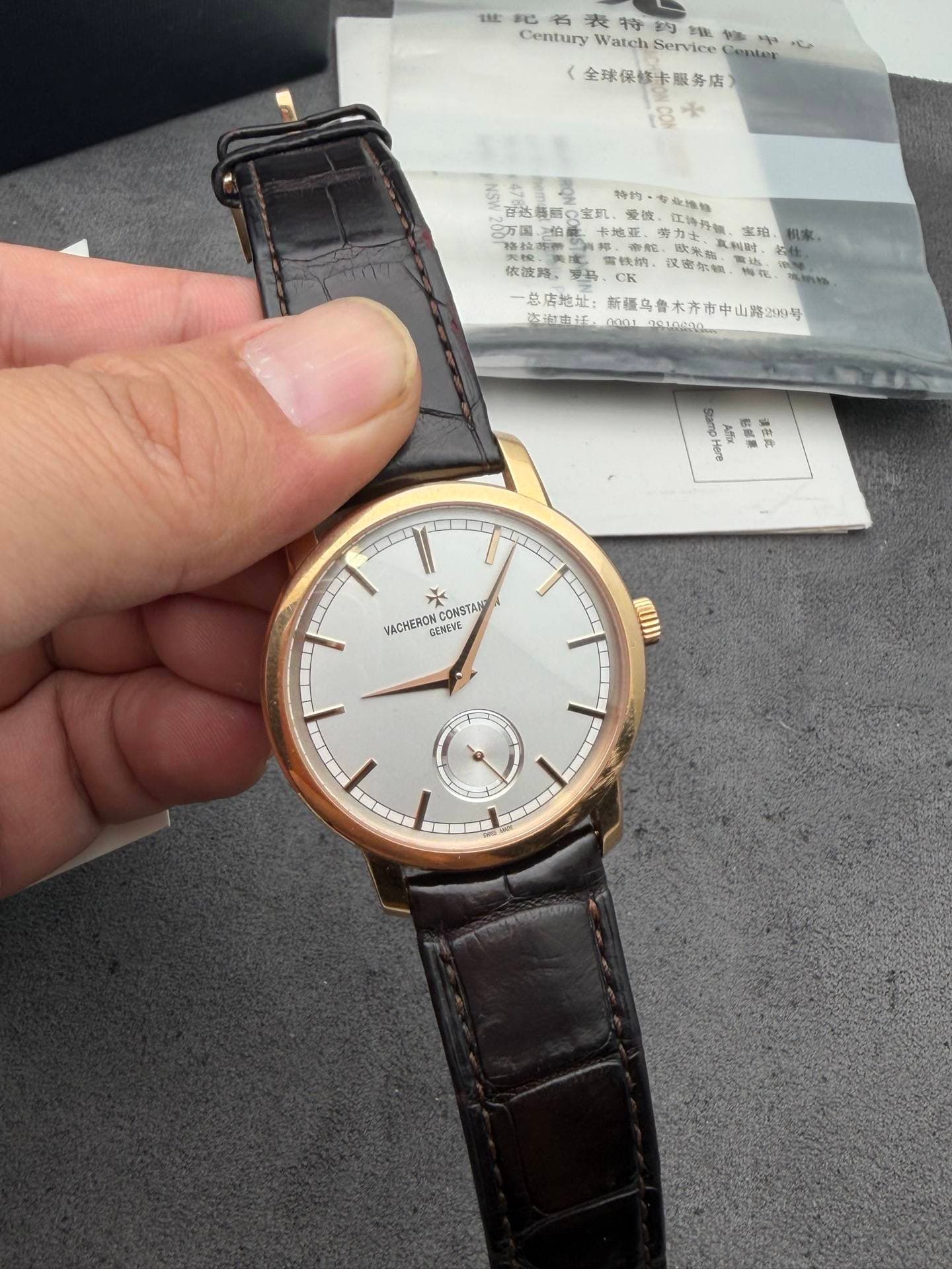 May be an image of wrist watch and text