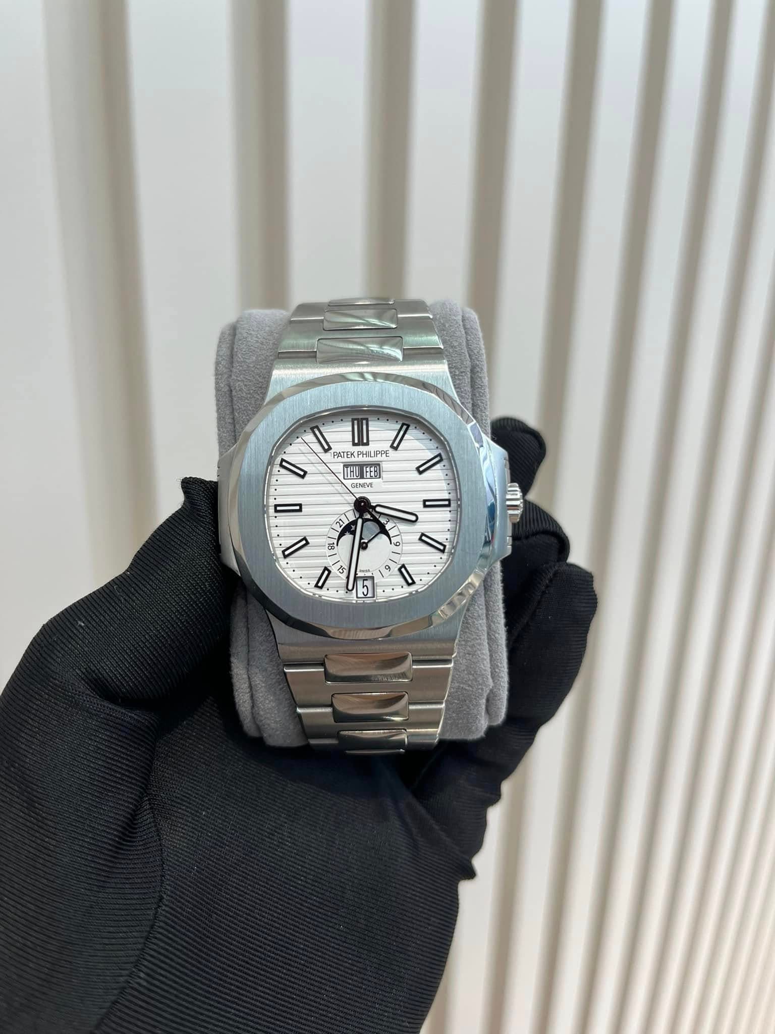 May be an image of wrist watch and text that says 'II PATEKPHILIPP PHILIPPE ATEK 理 主料 11: CENOVE 21 ጣቢ I D D - 2 8 a 5 /'