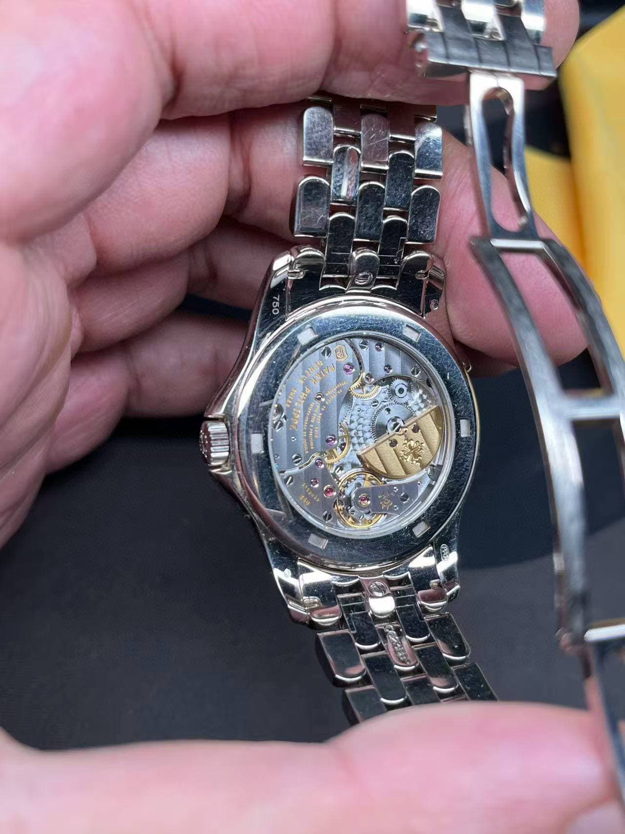May be an image of wrist watch and text