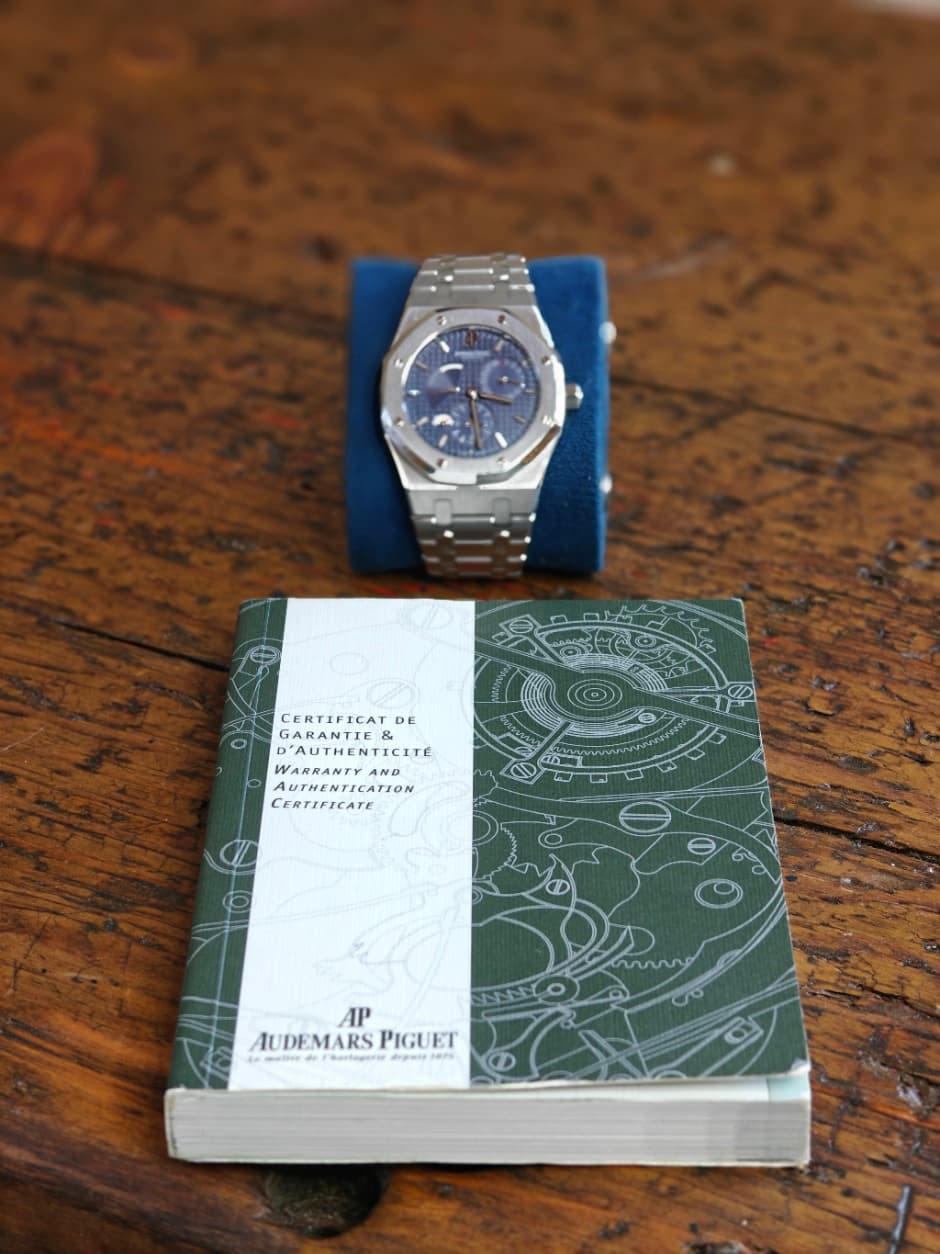 May be an image of wrist watch, map and text