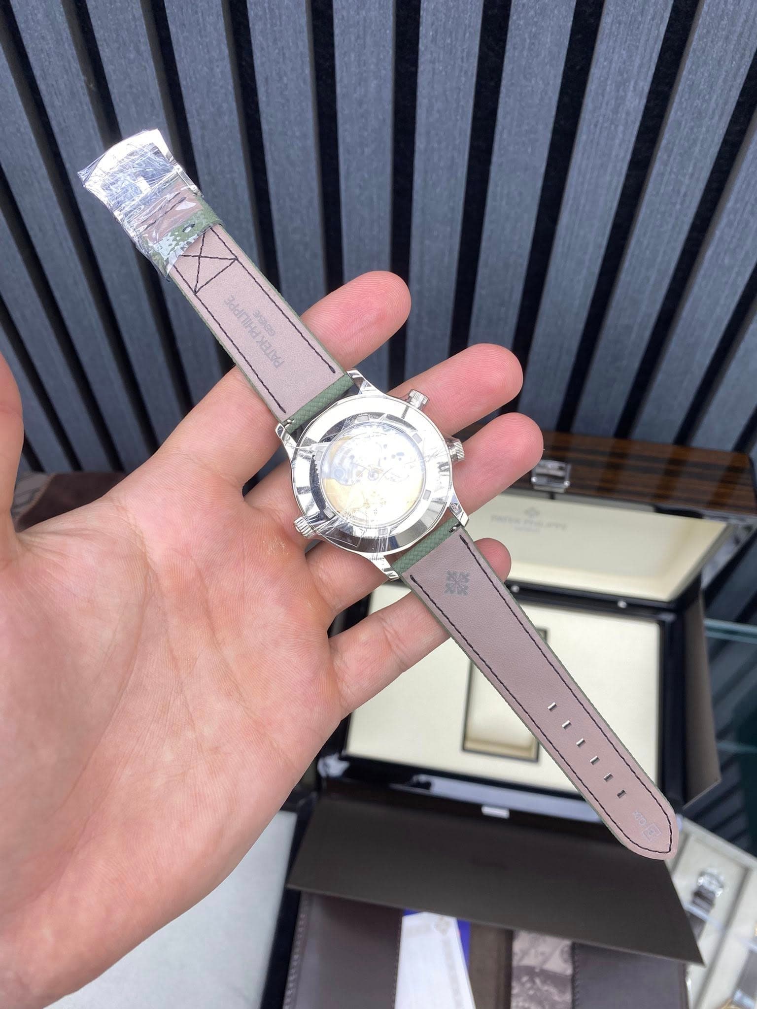 May be an image of wrist watch and text