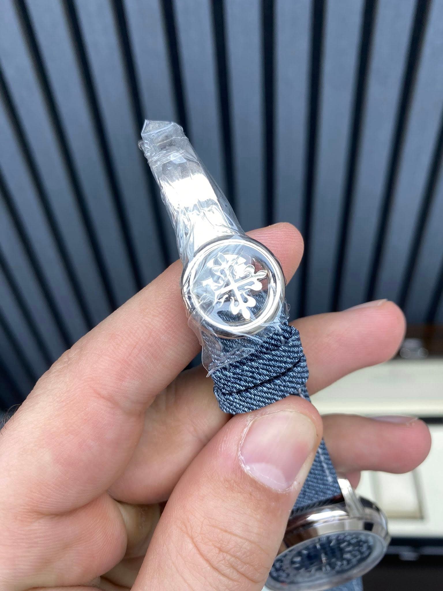 May be an image of wrist watch and text