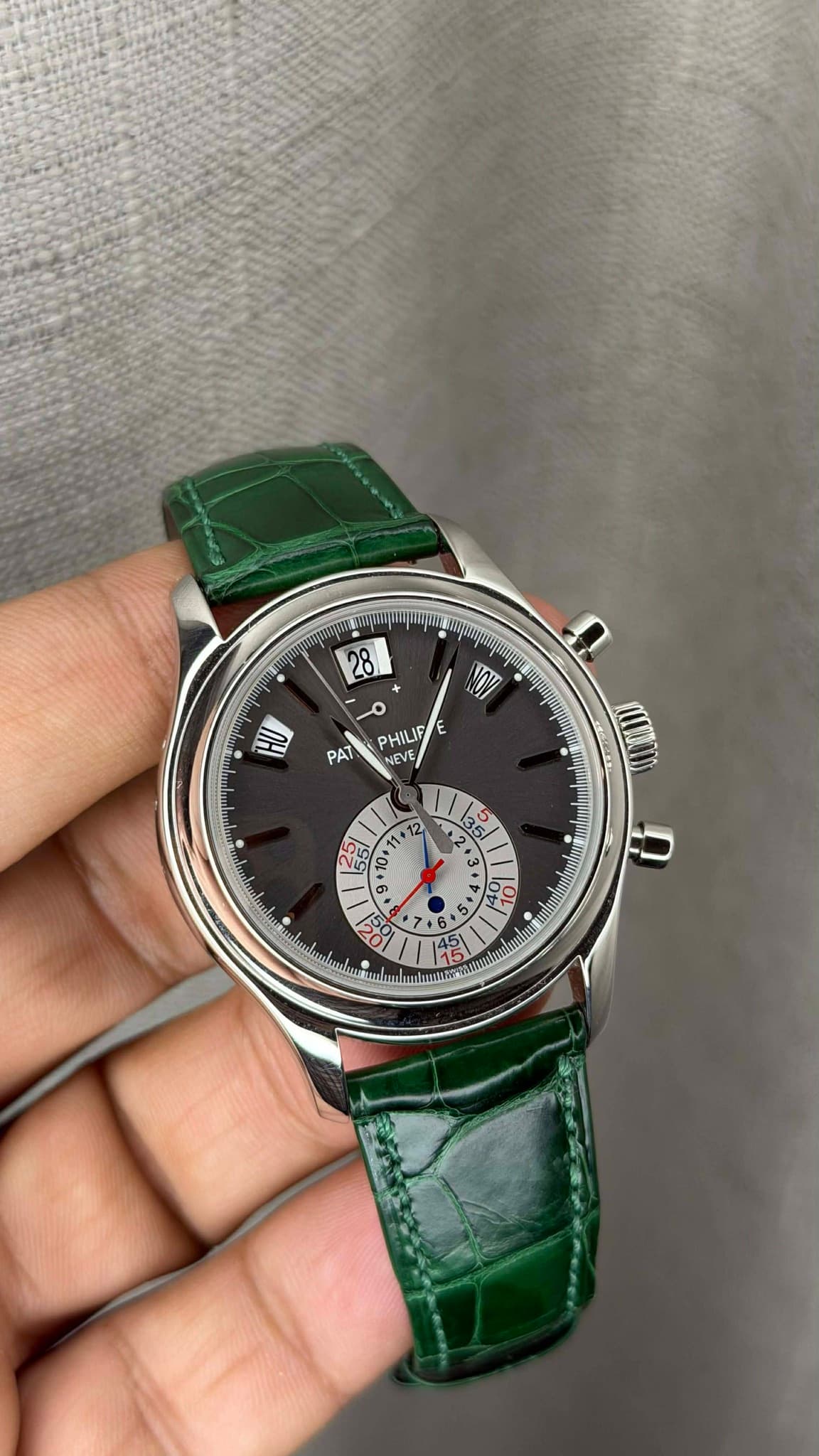 May be an image of wrist watch and text