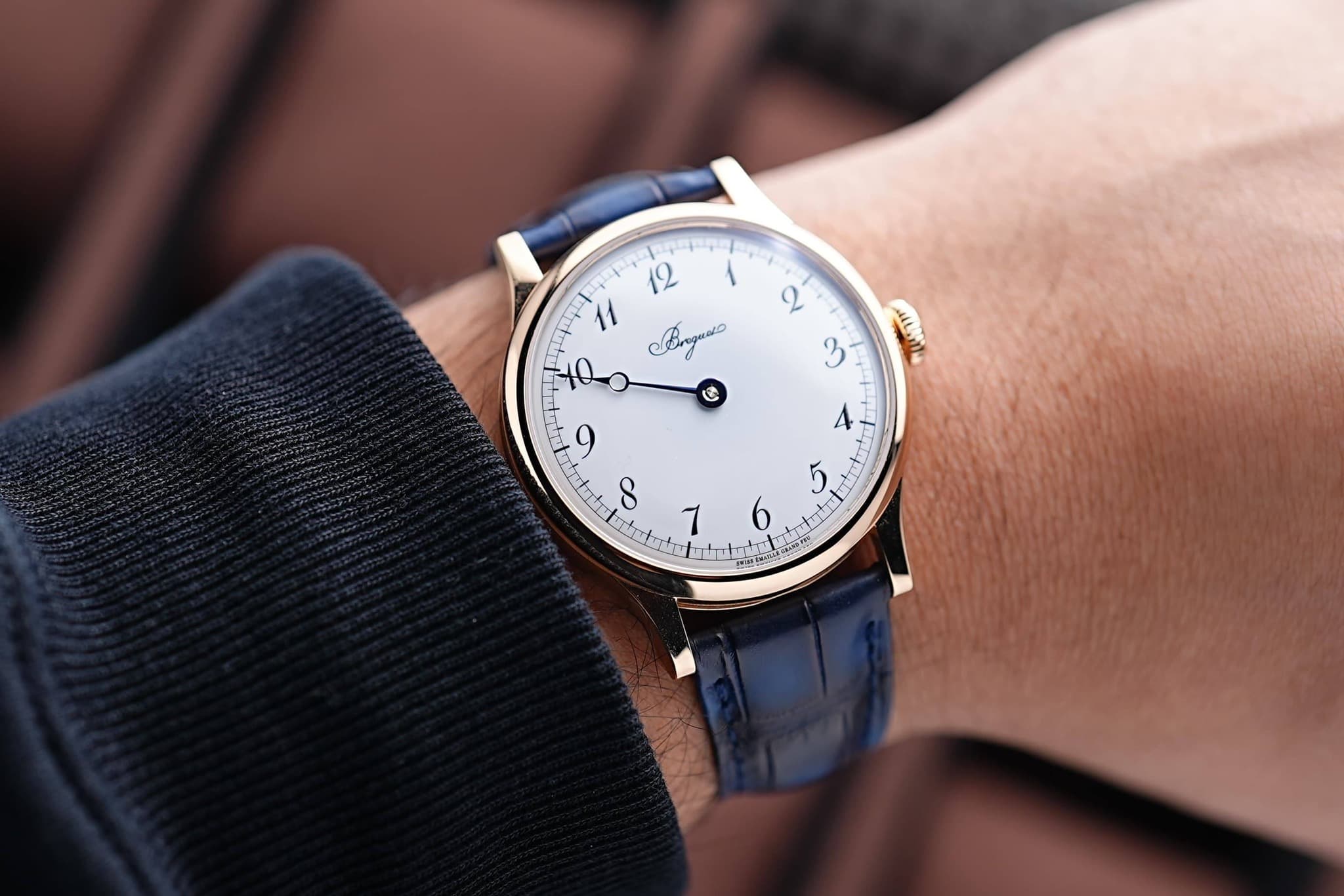 May be an image of wrist watch and text
