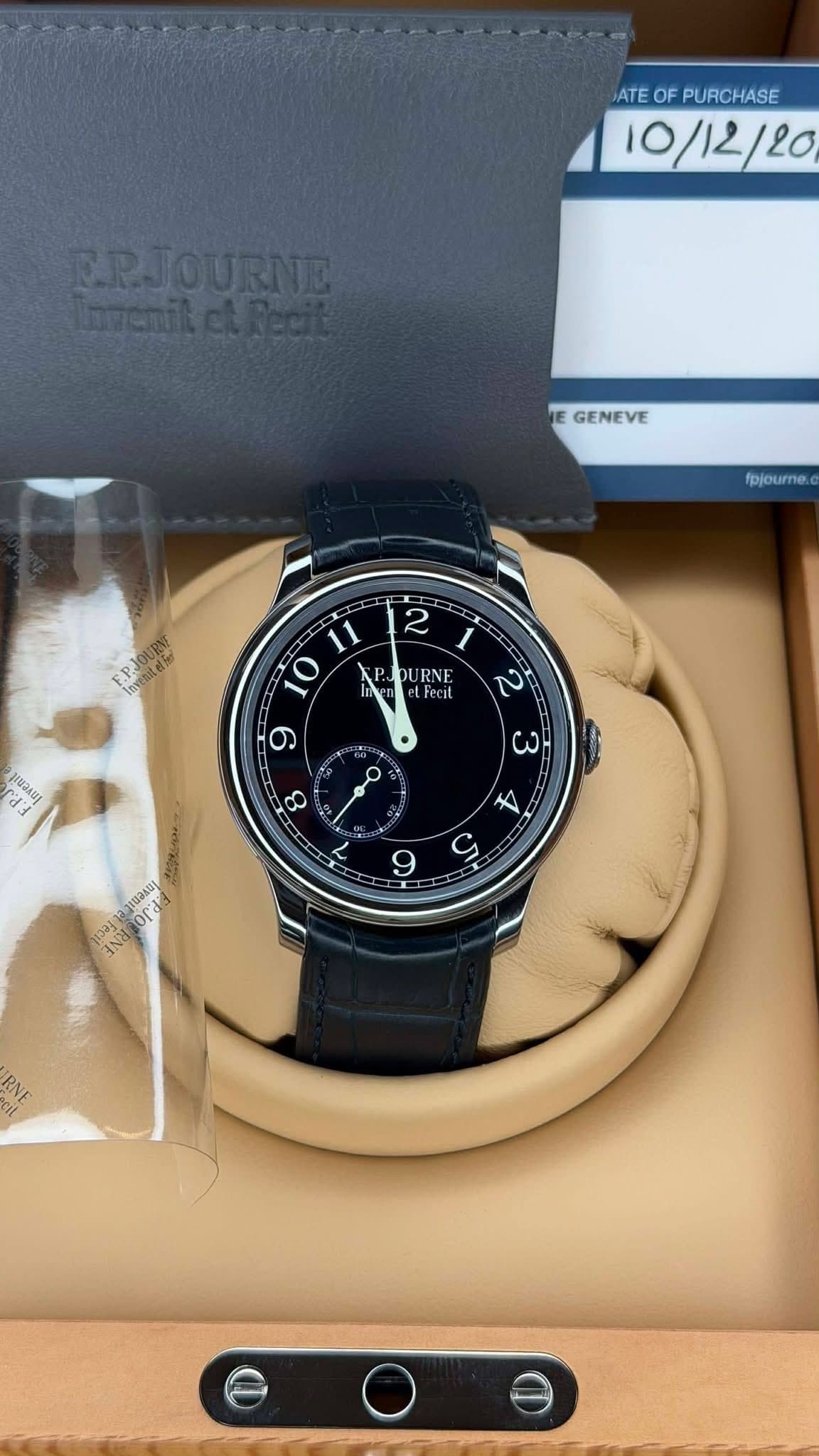 May be an image of wrist watch and text that says 'ATE TEOFPURCHASE OF PURCHASE 10/12/20 ERJOURNE GENEVE fpjourne. P PJ οι URNE Feci יב 9 O ωΗ 8 五 9 orda IN'