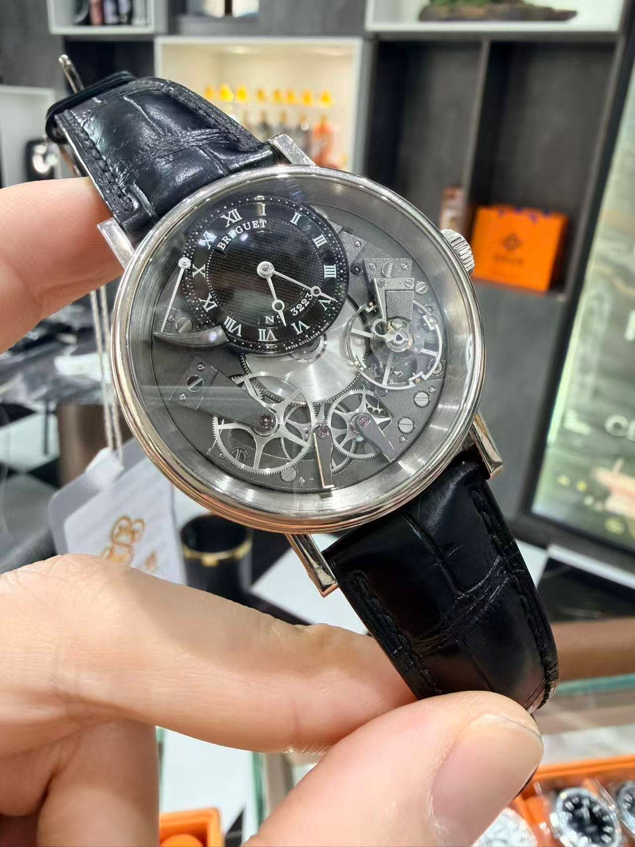 May be an image of wrist watch and text