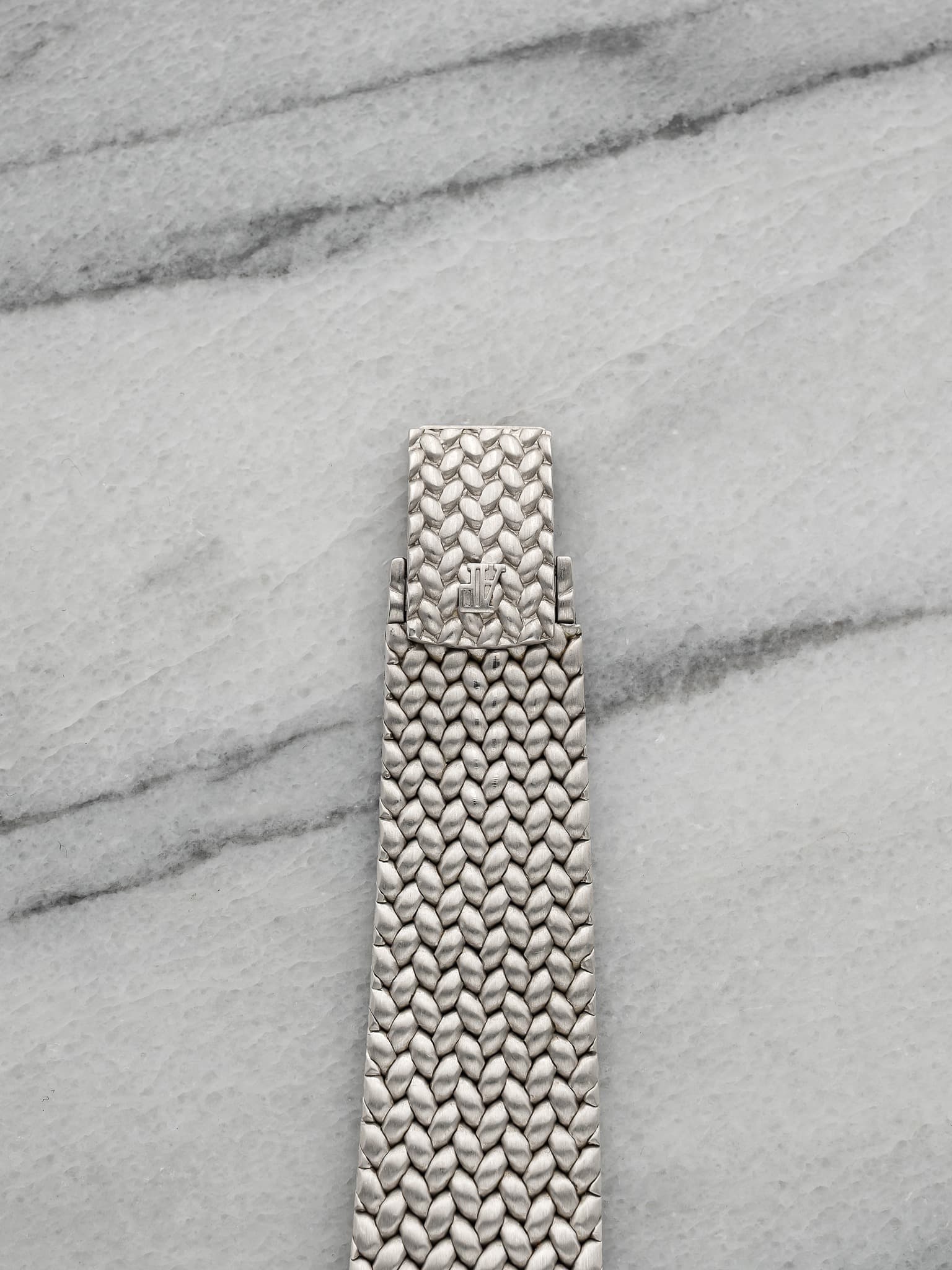 May be an image of wrist watch and jewelry