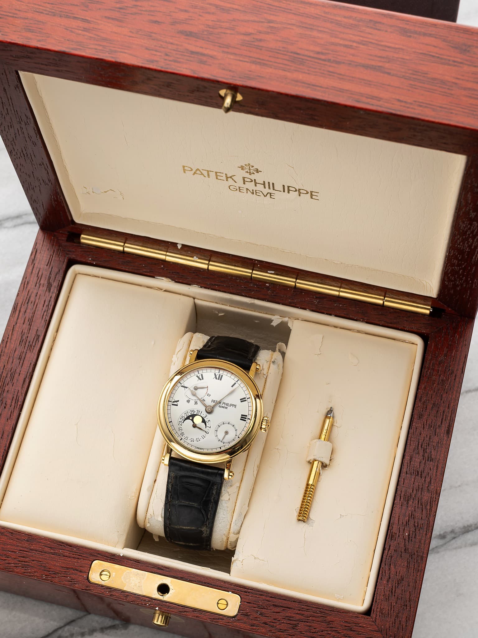 May be an image of wrist watch and text