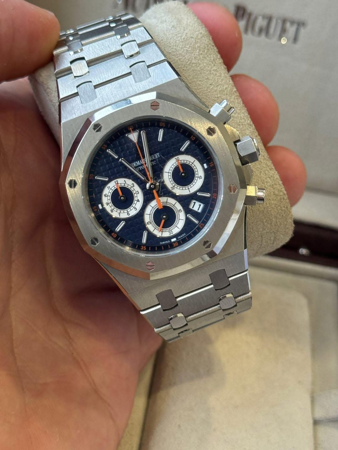 May be an image of wrist watch and text