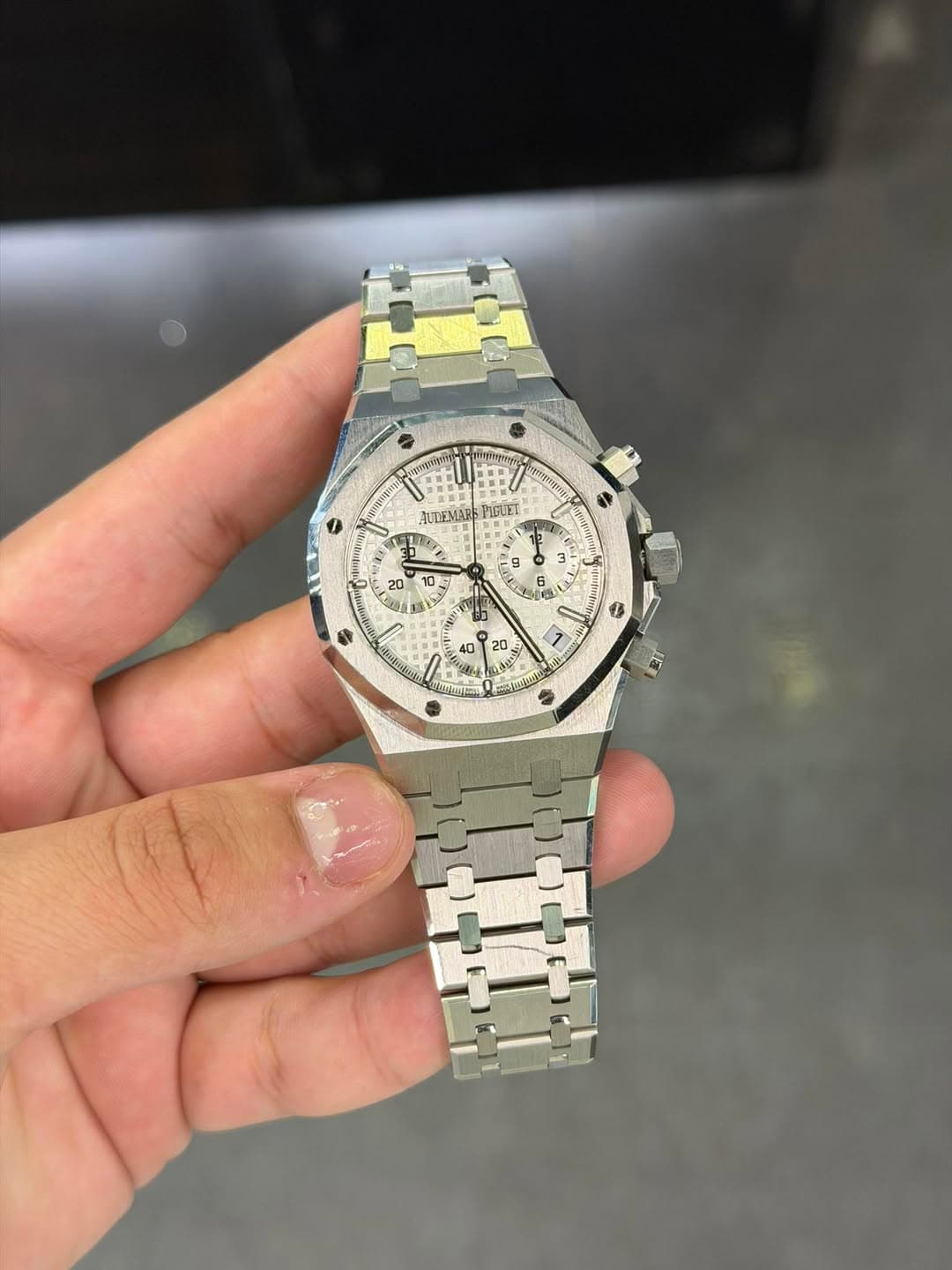 May be an image of wrist watch and text